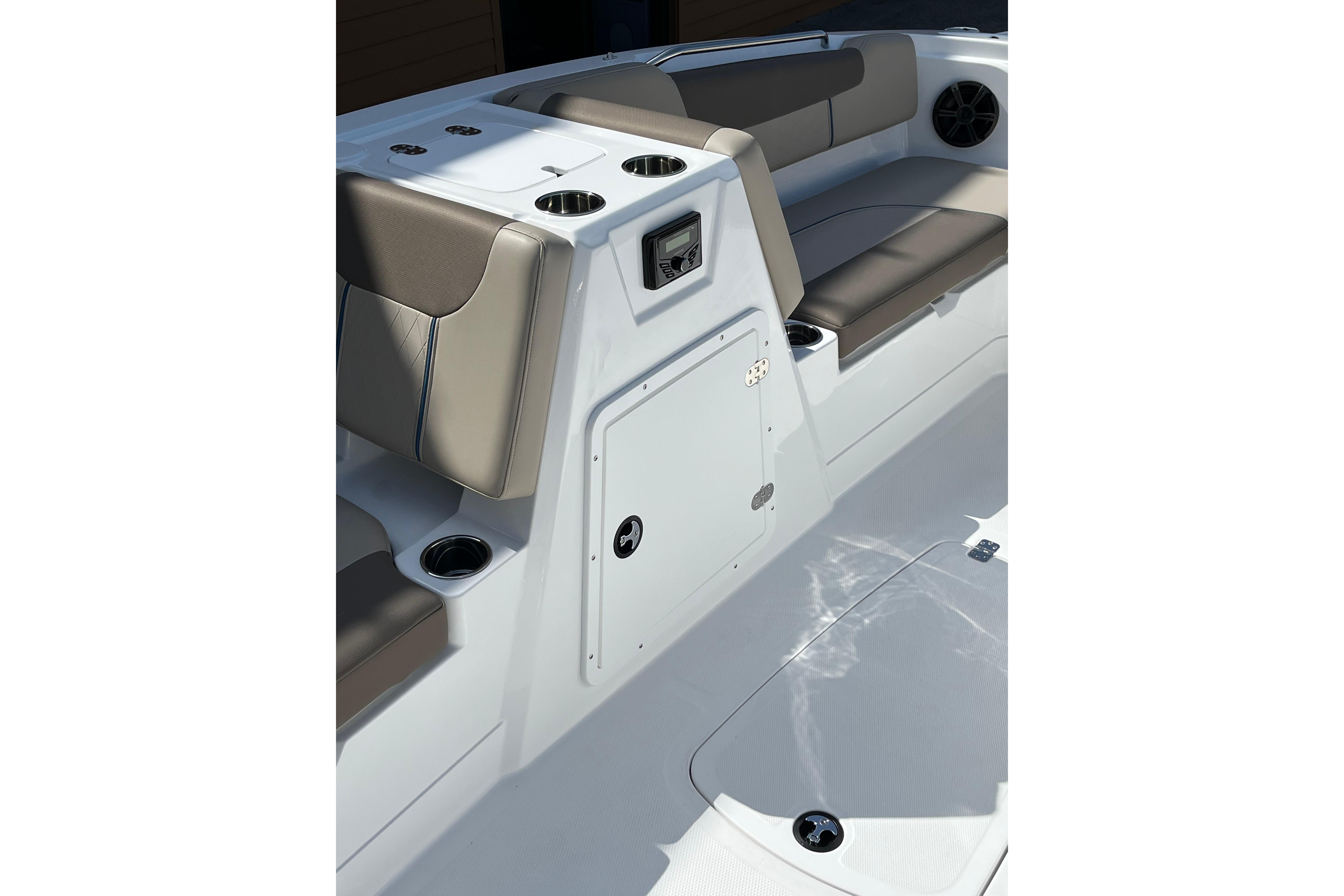 Interior of 2026 Tahoe 1950 boat featuring cushioned seating and storage compartments.