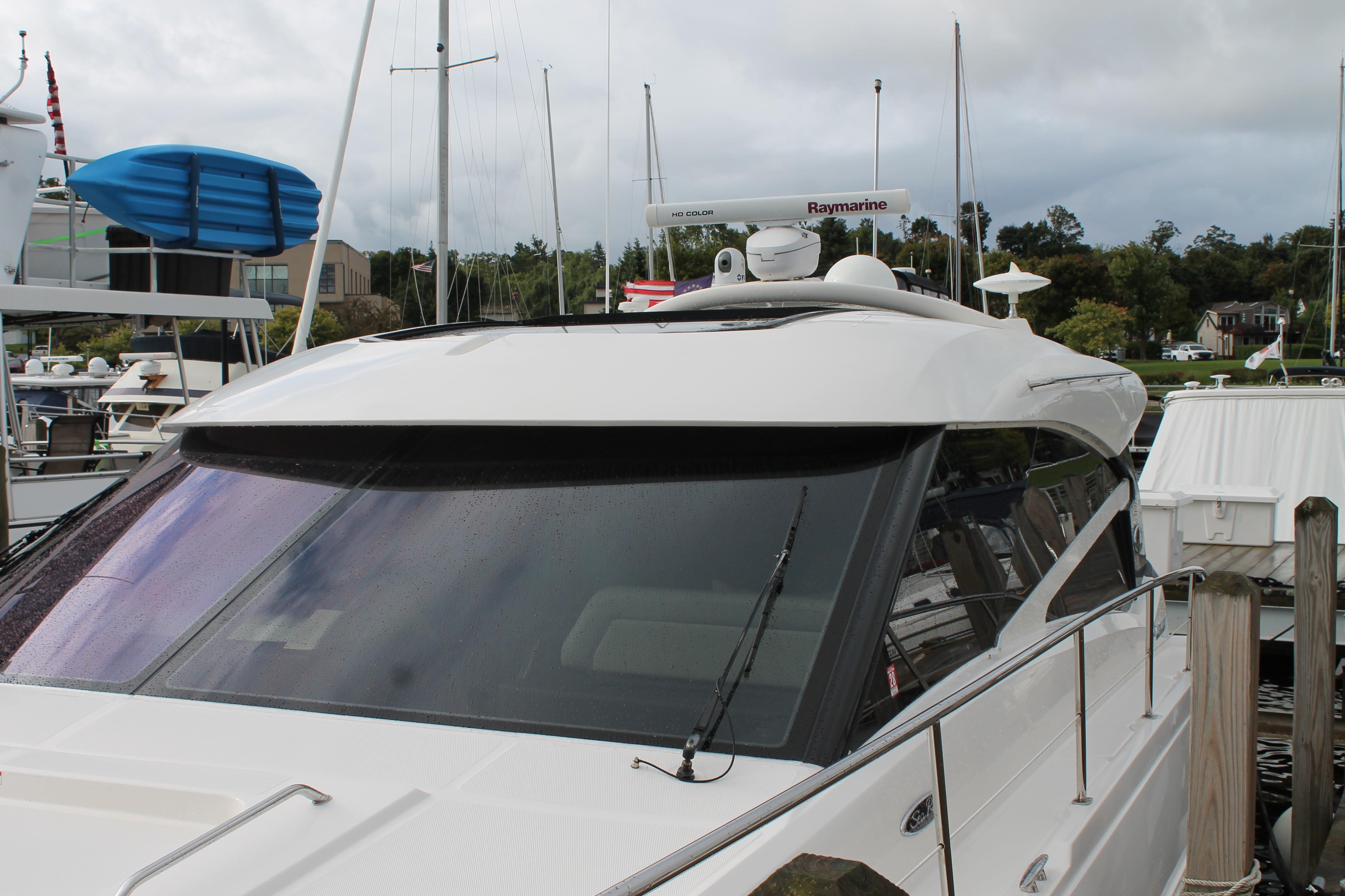 2015 Sea Ray 470 Sundancer yacht docked at marina, featuring sleek design and modern equipment.