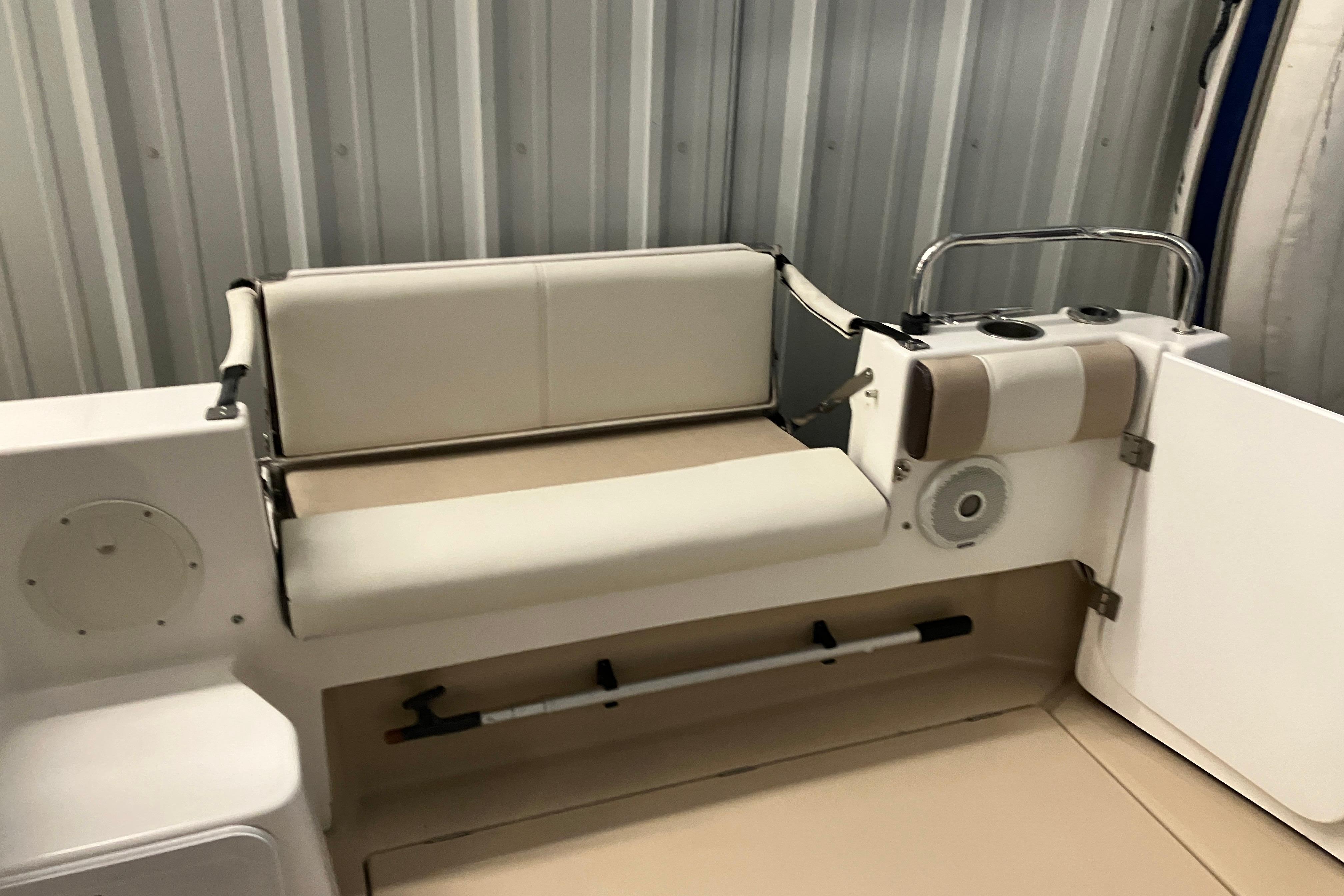 2017 Cutwater C-30 Sedan boat interior with cushioned seating and storage.