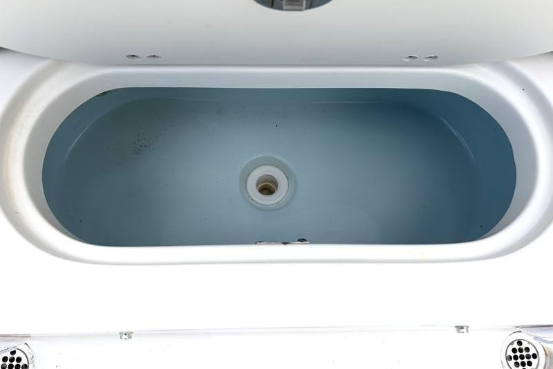 Livewell compartment of 2024 Key West 239 FS boat, featuring a clean, oval design.