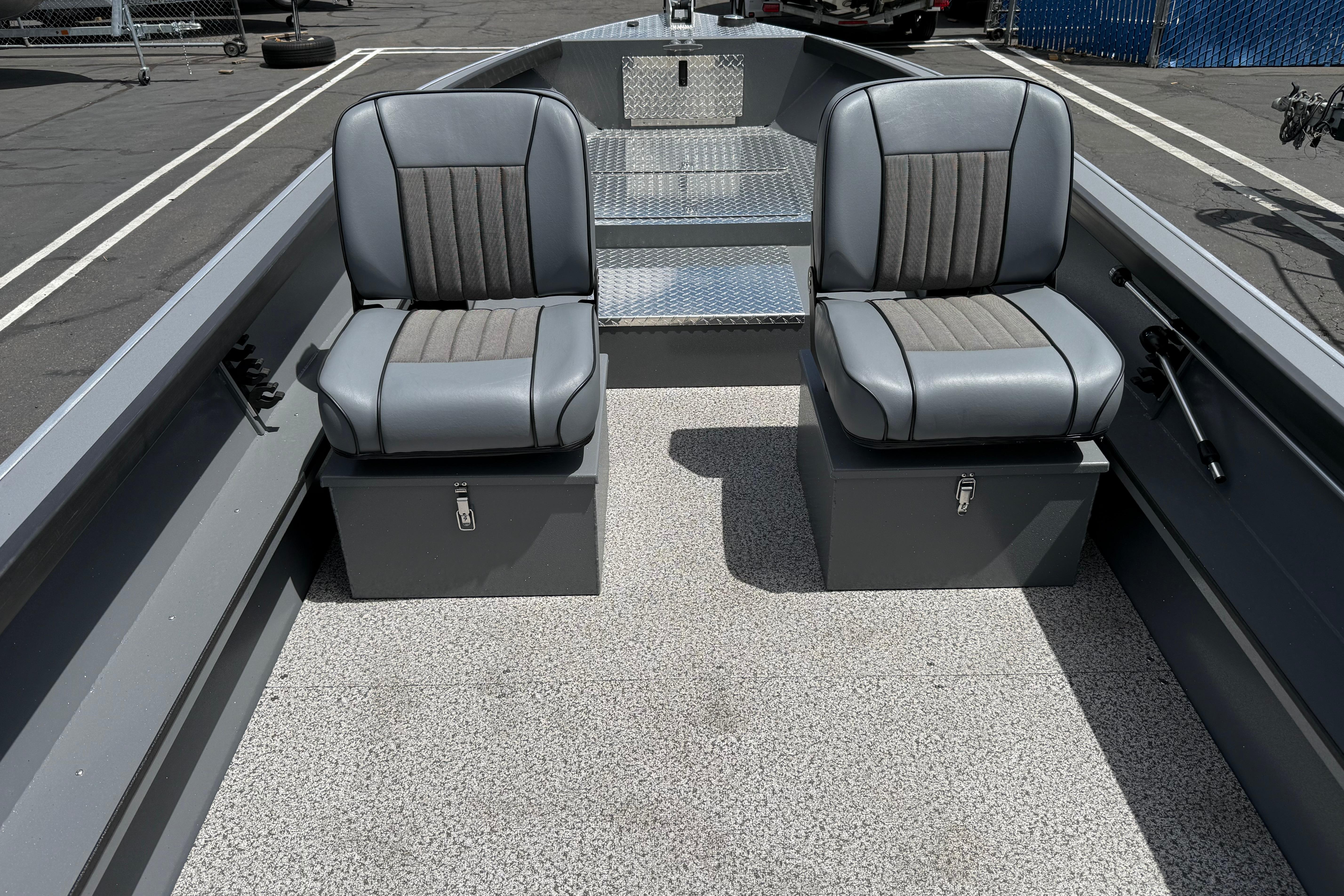 2026 Alumaweld Free Drifter 20 interior with two gray seats and storage compartments.