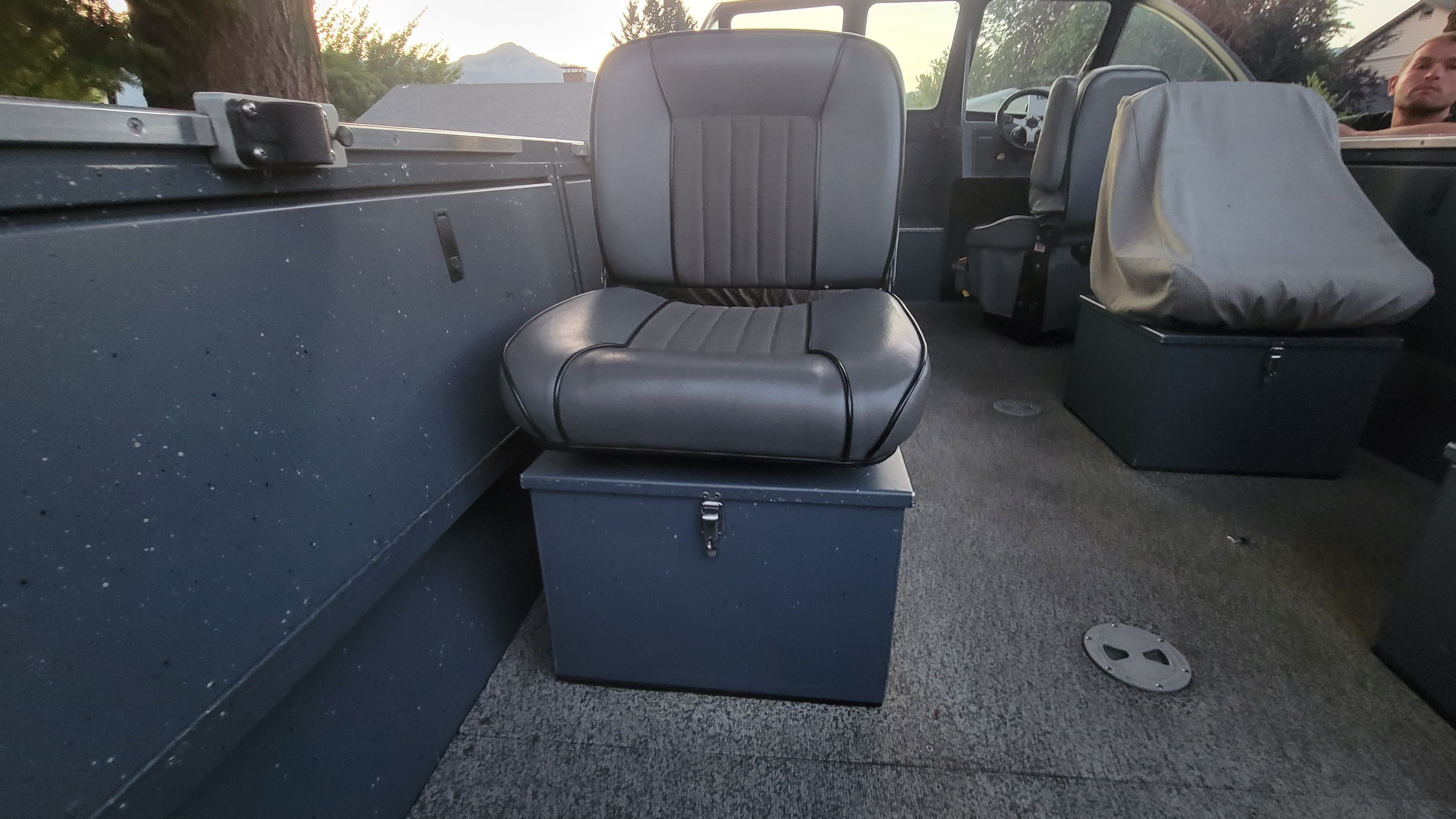 Interior of a 2015 Alumaweld Formula Vee Outboard 24 with gray seating.
