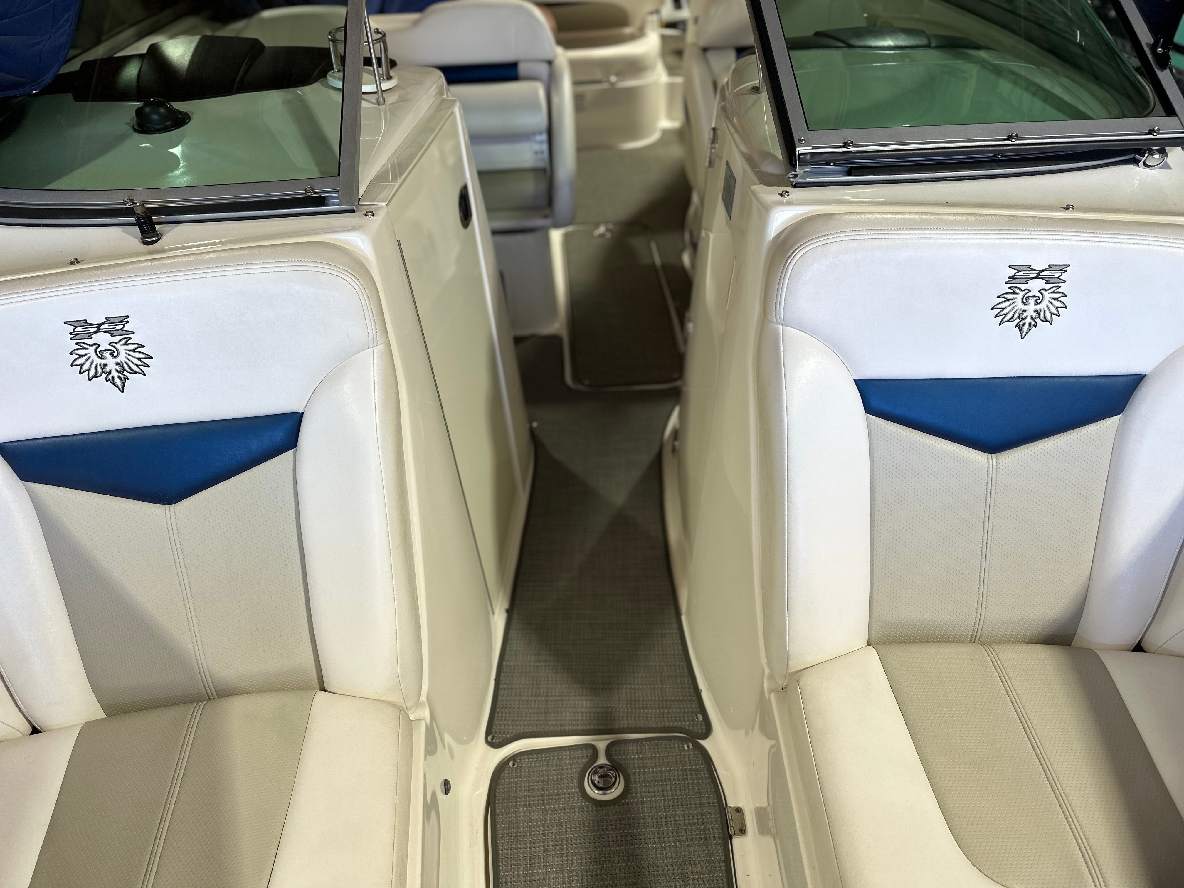 Interior of a 2011 Chaparral 287 SSX with white and blue seating.