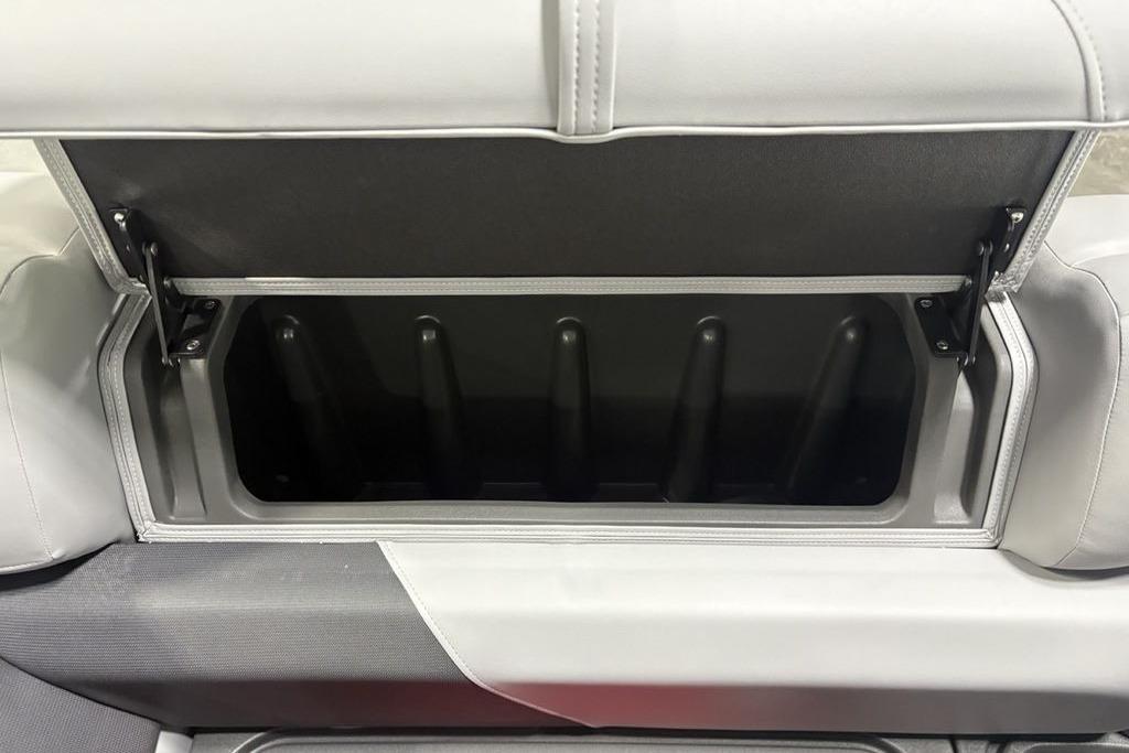 2026 Sun Tracker PARTY BARGE® 20 DLX storage compartment with open lid and sleek design.