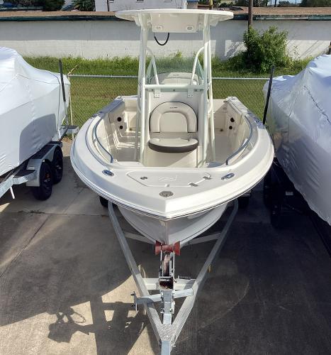 2022 Sailfish 220 CC boat on trailer, parked outdoors.