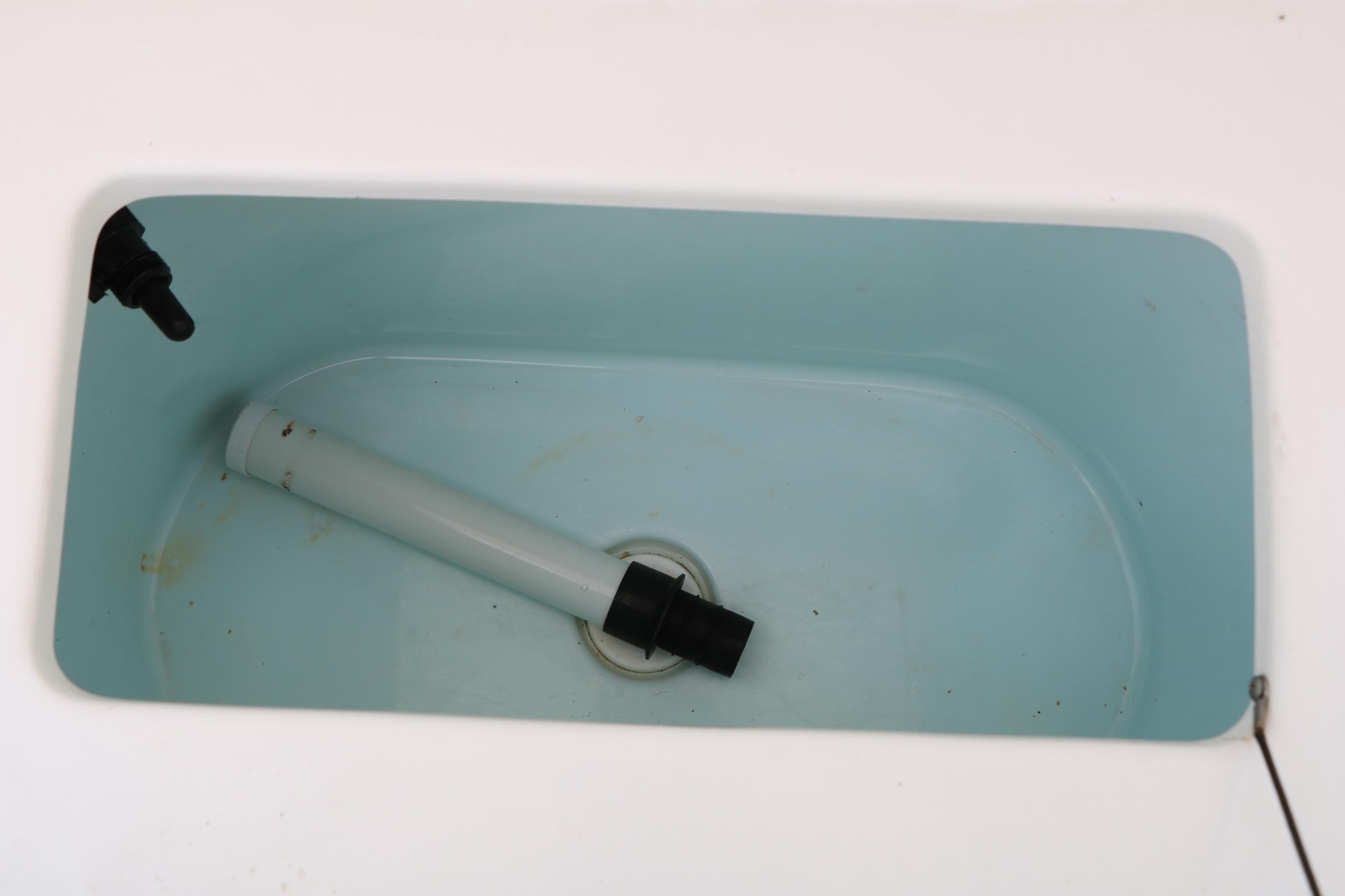 Livewell interior of 2015 Sea Hunt BX 22 BR boat, featuring a drain pipe.