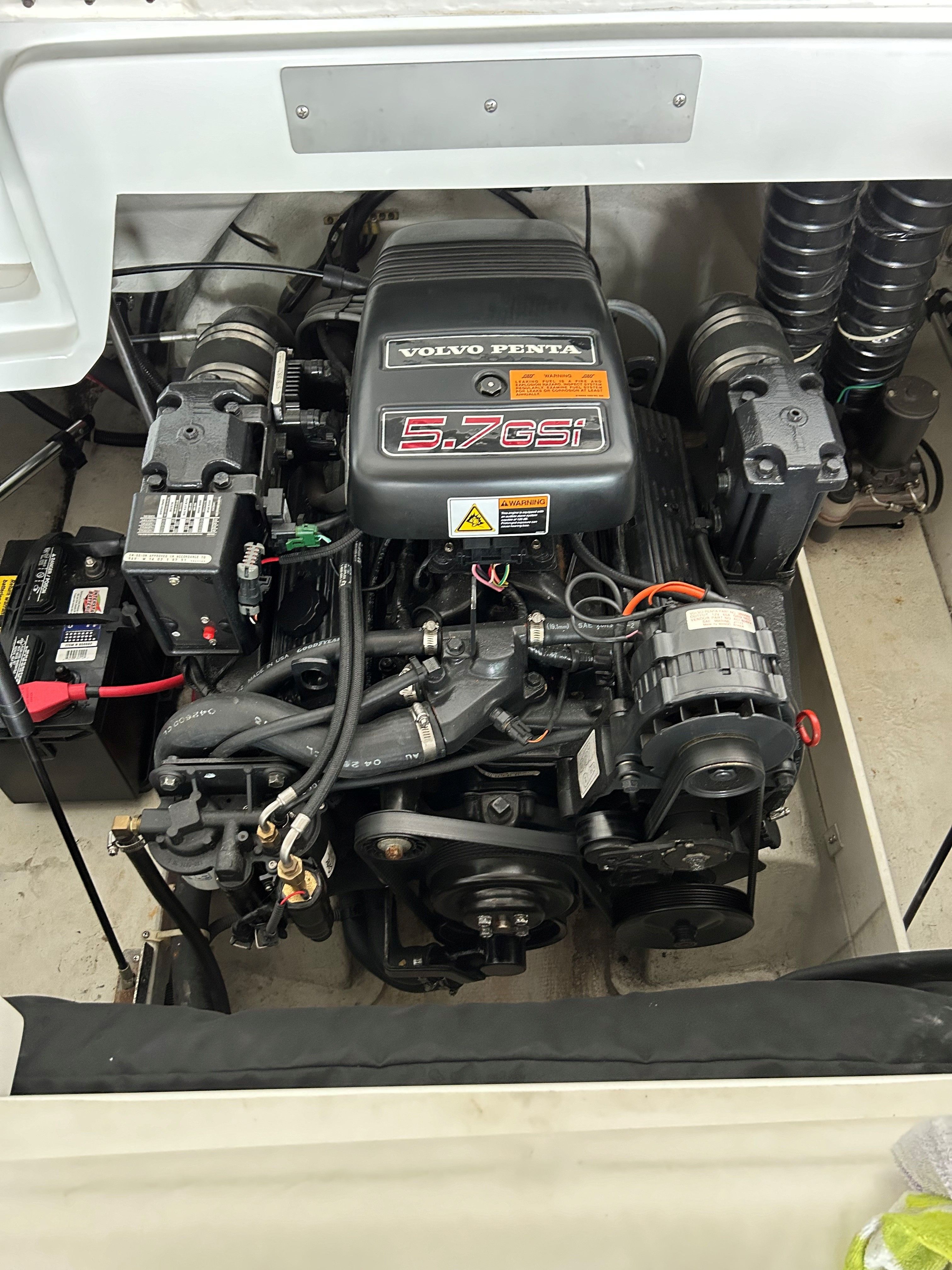 A Volvo Penta 5.7GSi engine in a boat's engine compartment.