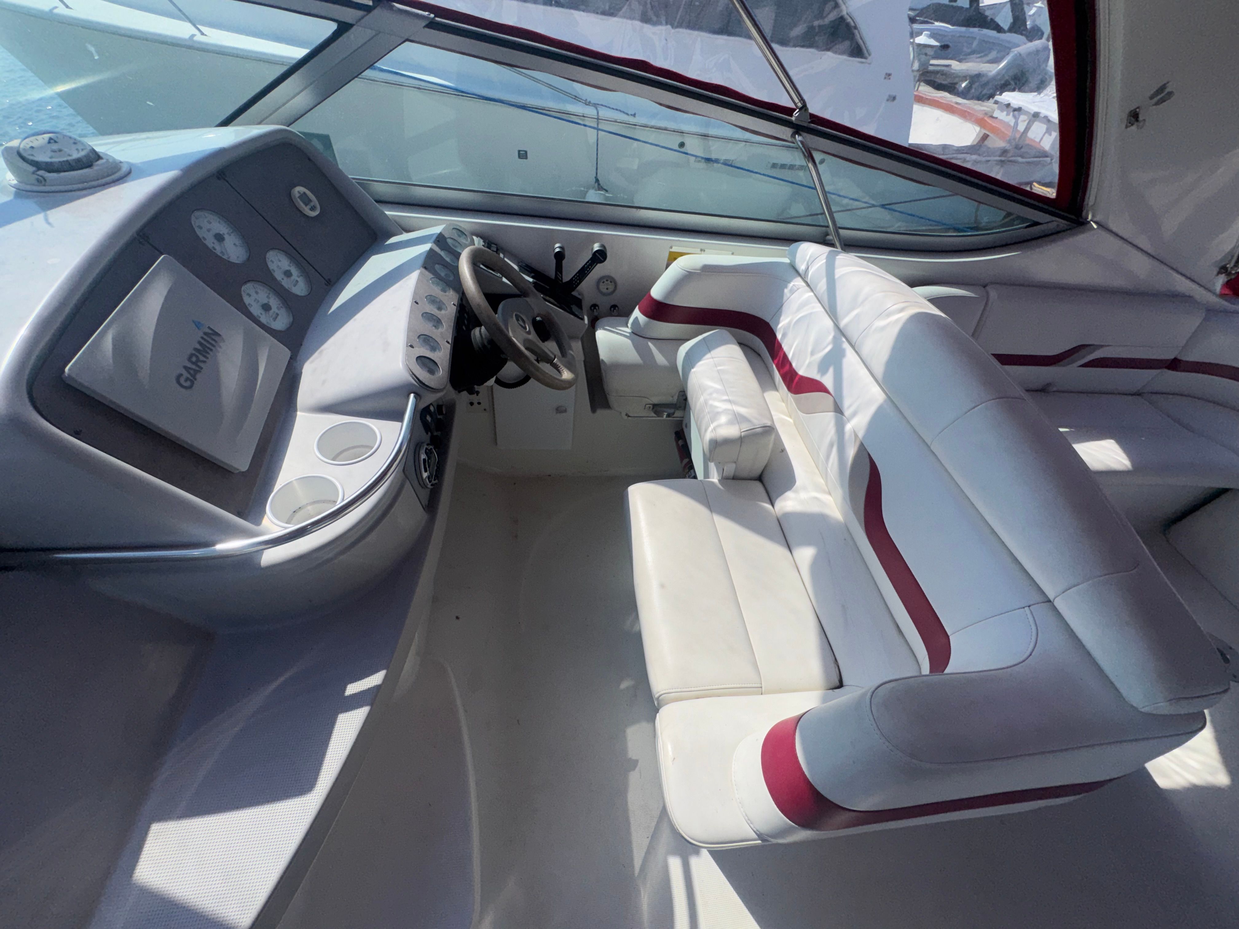 Interior of a 2001 Formula 37 SUPER SPORT boat with helm console.