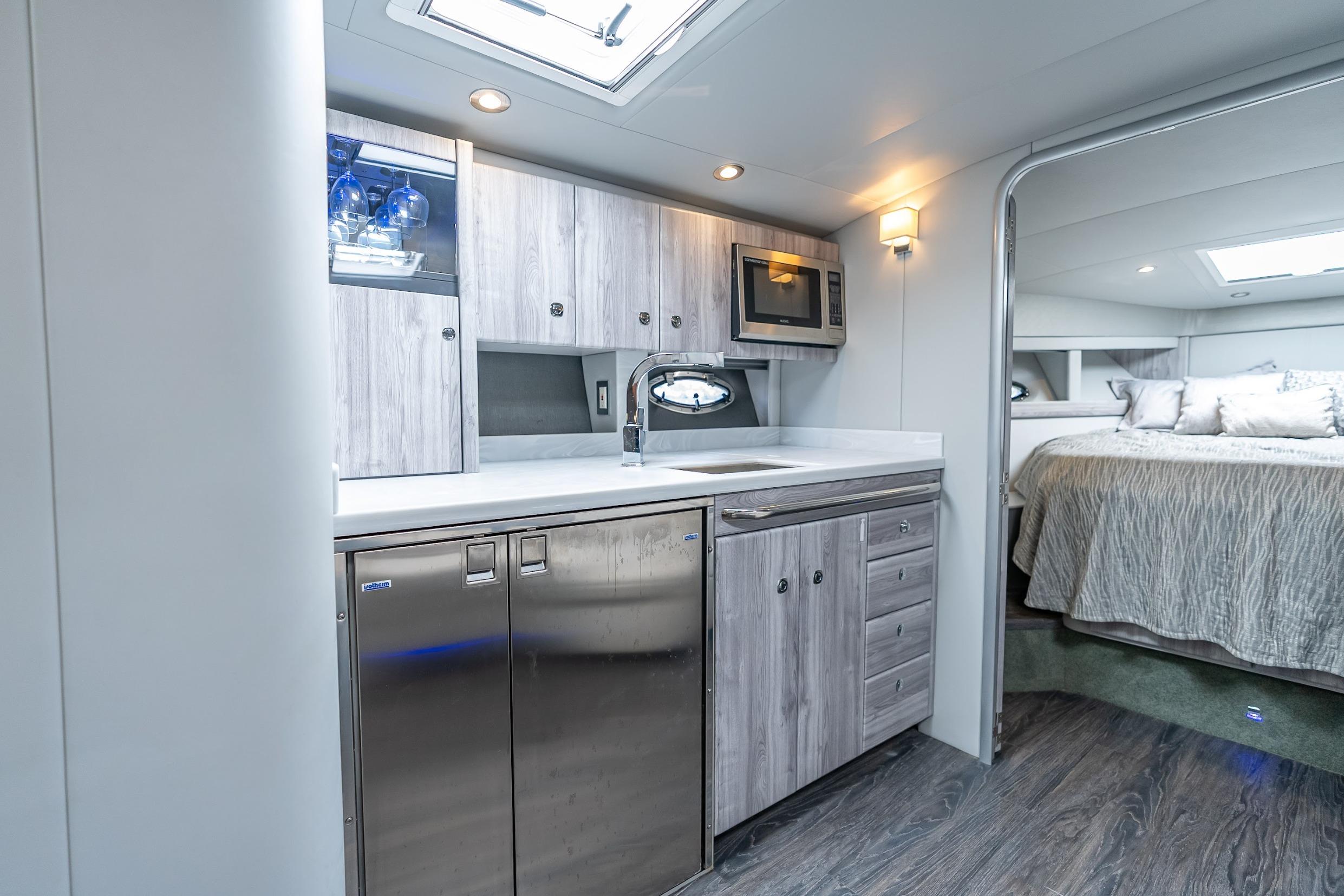 2022 Formula 40 Performance Cruiser interior with modern kitchen and cozy bedroom.