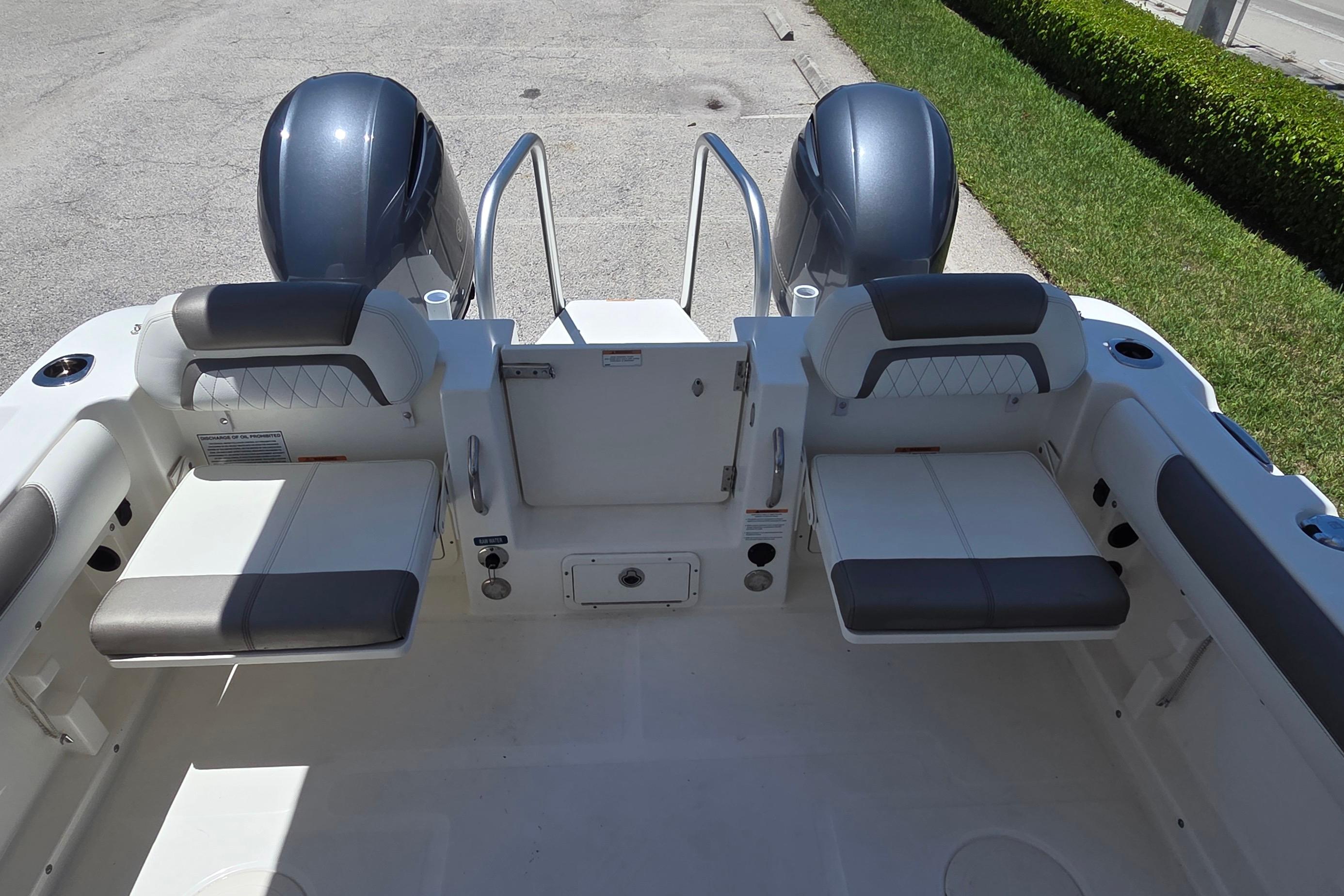2022 World Cat 255 DC boat interior with dual engines and seating.
