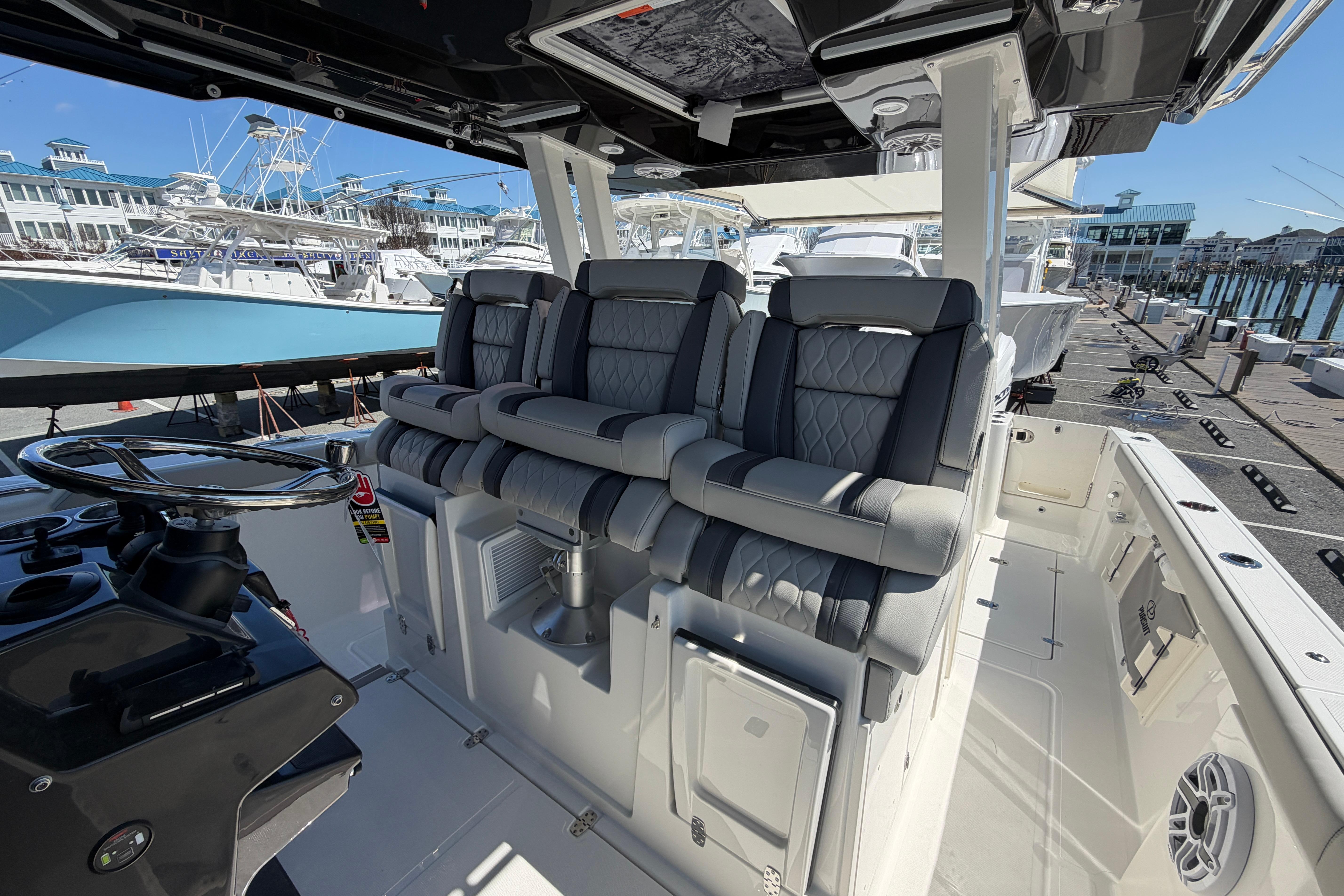 2026 Pursuit S 358 Sport boat interior with luxurious seating and modern helm design.
