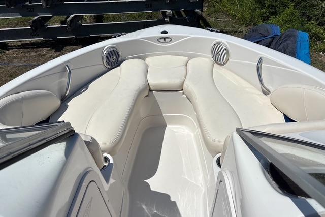 2012 Tahoe Q8 SSi boat interior with white cushioned seating and speakers.
