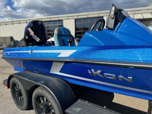 2024 iKon LX 20 blue boat on trailer with outboard motor.