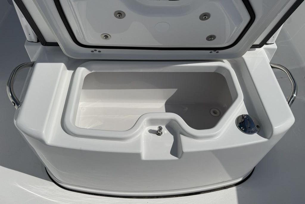 2026 Sportsman Open 252 Center Console boat storage compartment, open lid view.
