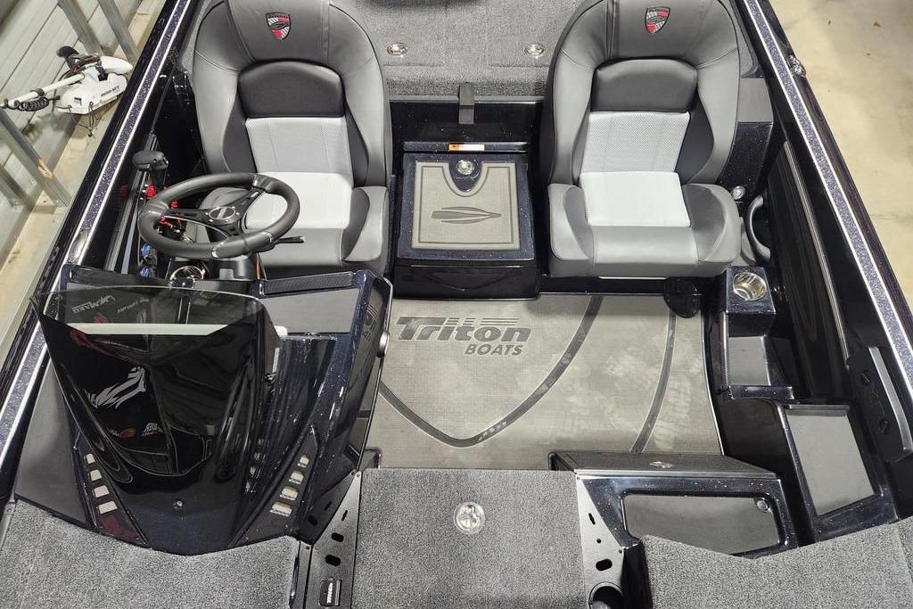 2026 Triton 20XP Patriot boat interior with dual seats and steering wheel.