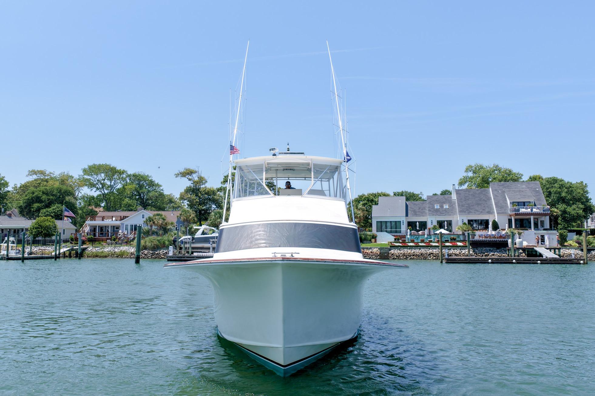 1998 Blackwell Custom Carolina Sportfish boat on water, with waterfront homes in the background.