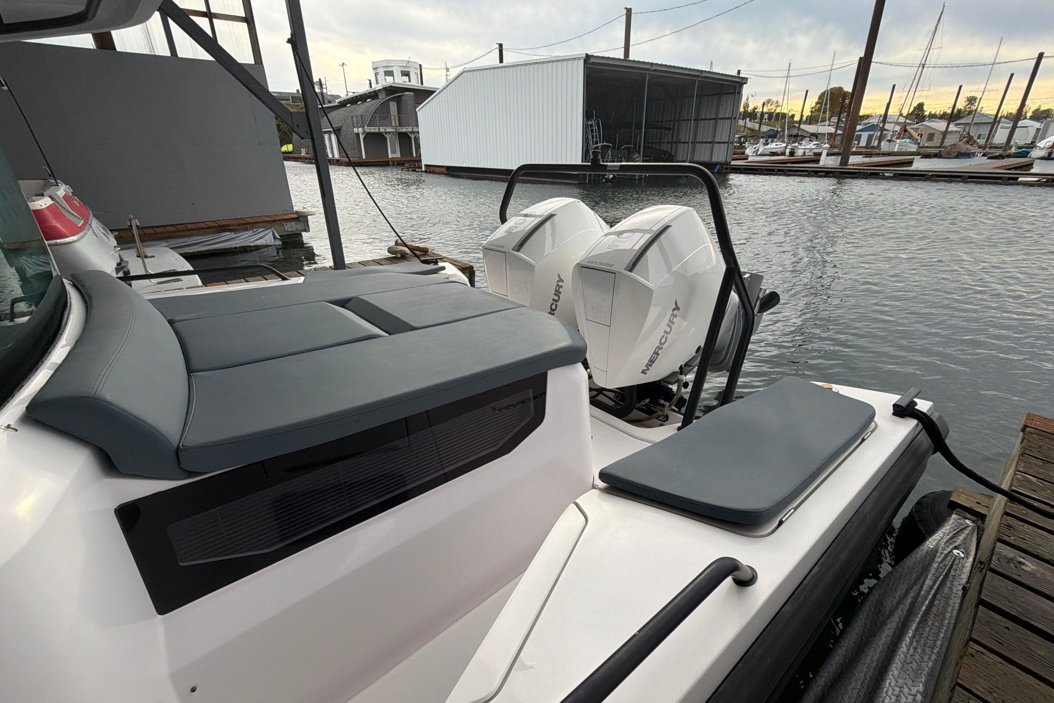 2022 Axopar Brabus 37 XC Cross Cabin with twin Mercury engines docked at marina.