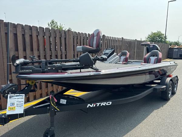 2025 Nitro Z20 XL Pro fishing boat on trailer, parked outdoors.