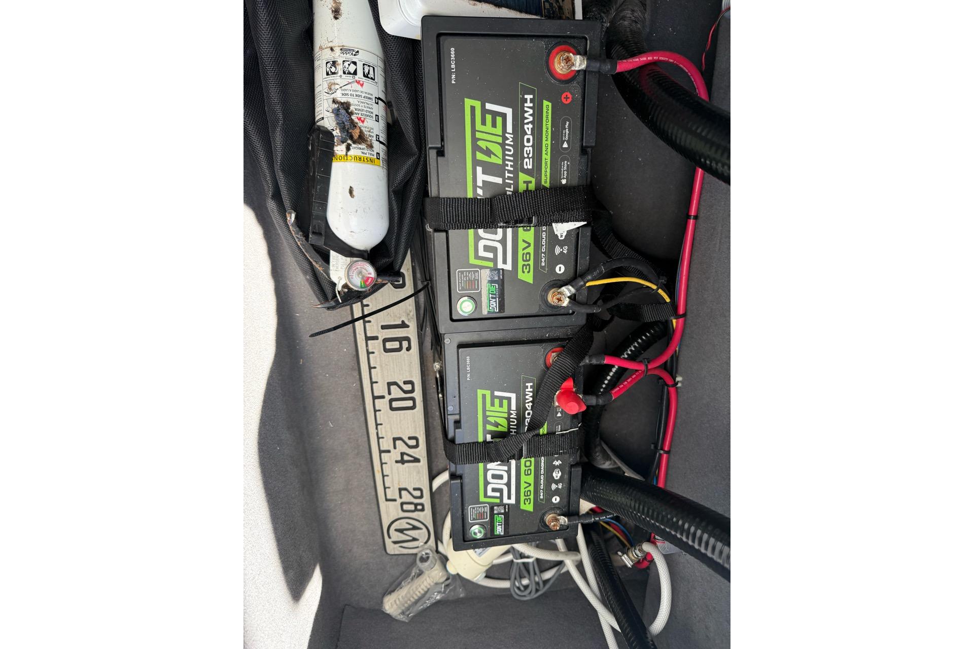 Three lithium batteries and a fire extinguisher in a Custom Infusion 34 CC boat, 2021 model.