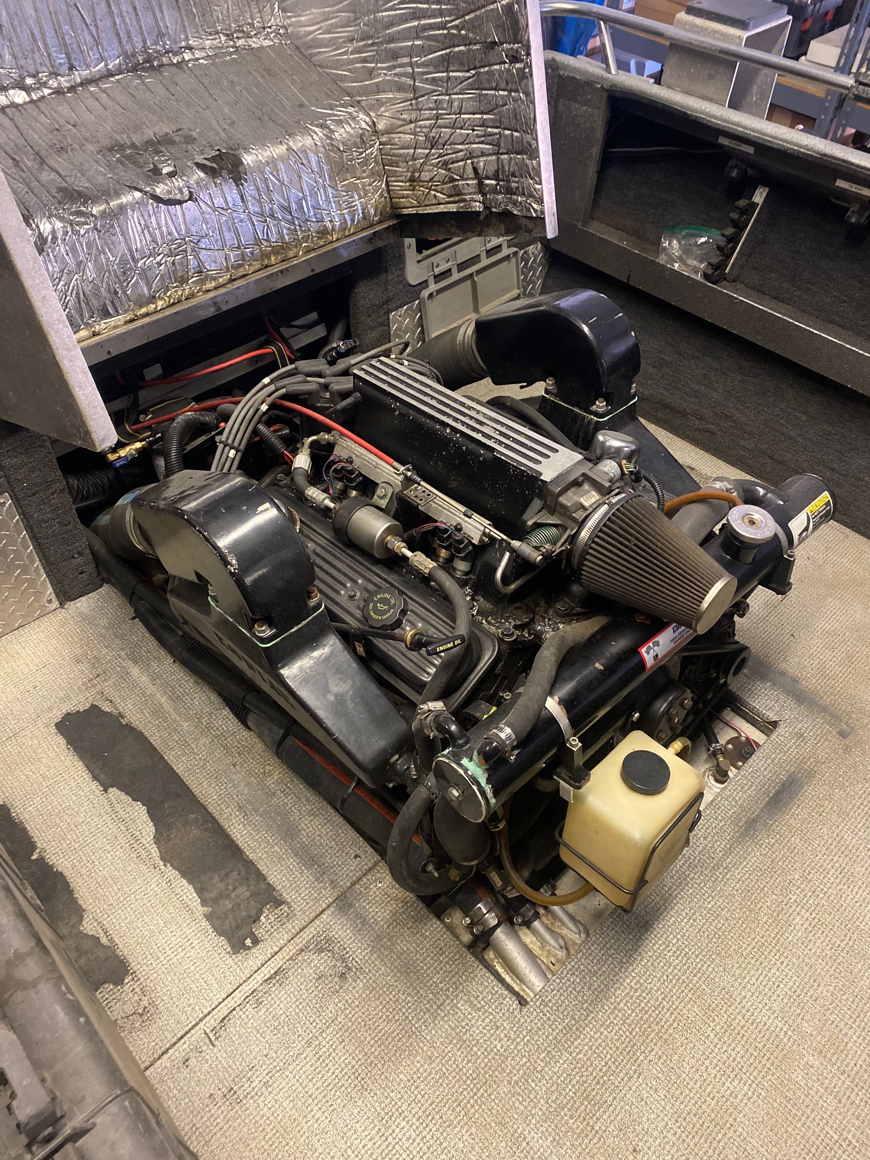 Engine of a 1993 Jetcraft Fastwater boat in the engine compartment.