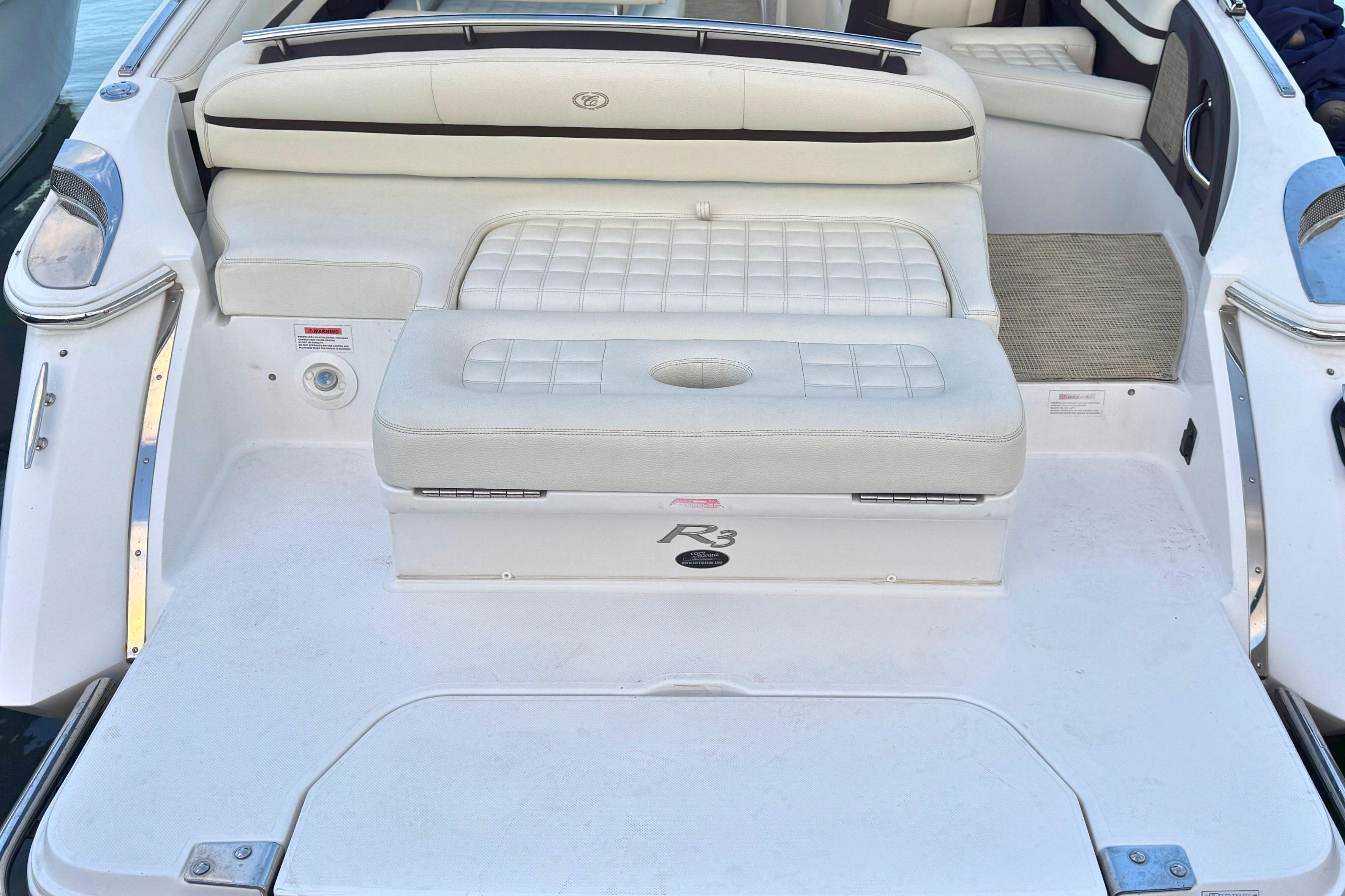 2019 Cobalt R3 boat interior with white cushioned seating and sleek design.