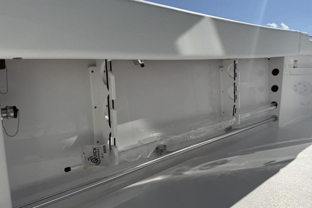 2026 Sportsman Open 232 Center Console interior detail with storage compartment and fixtures.