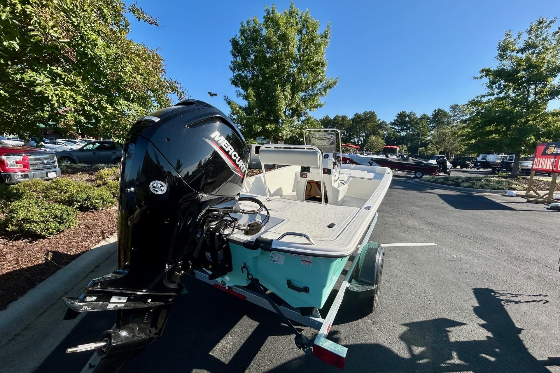 2026 Mako Pro Skiff 17 CC with Mercury outboard engine in parking lot.