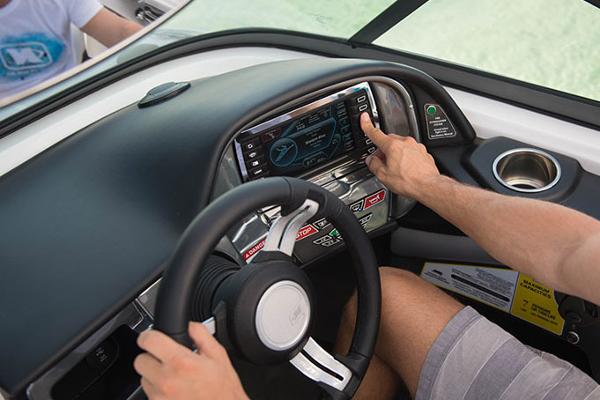 Manufacturer Provided Image: 2016 Nautique Ski Nautique 200 Closed Bow dashboard with touchscreen controls and steering wheel.