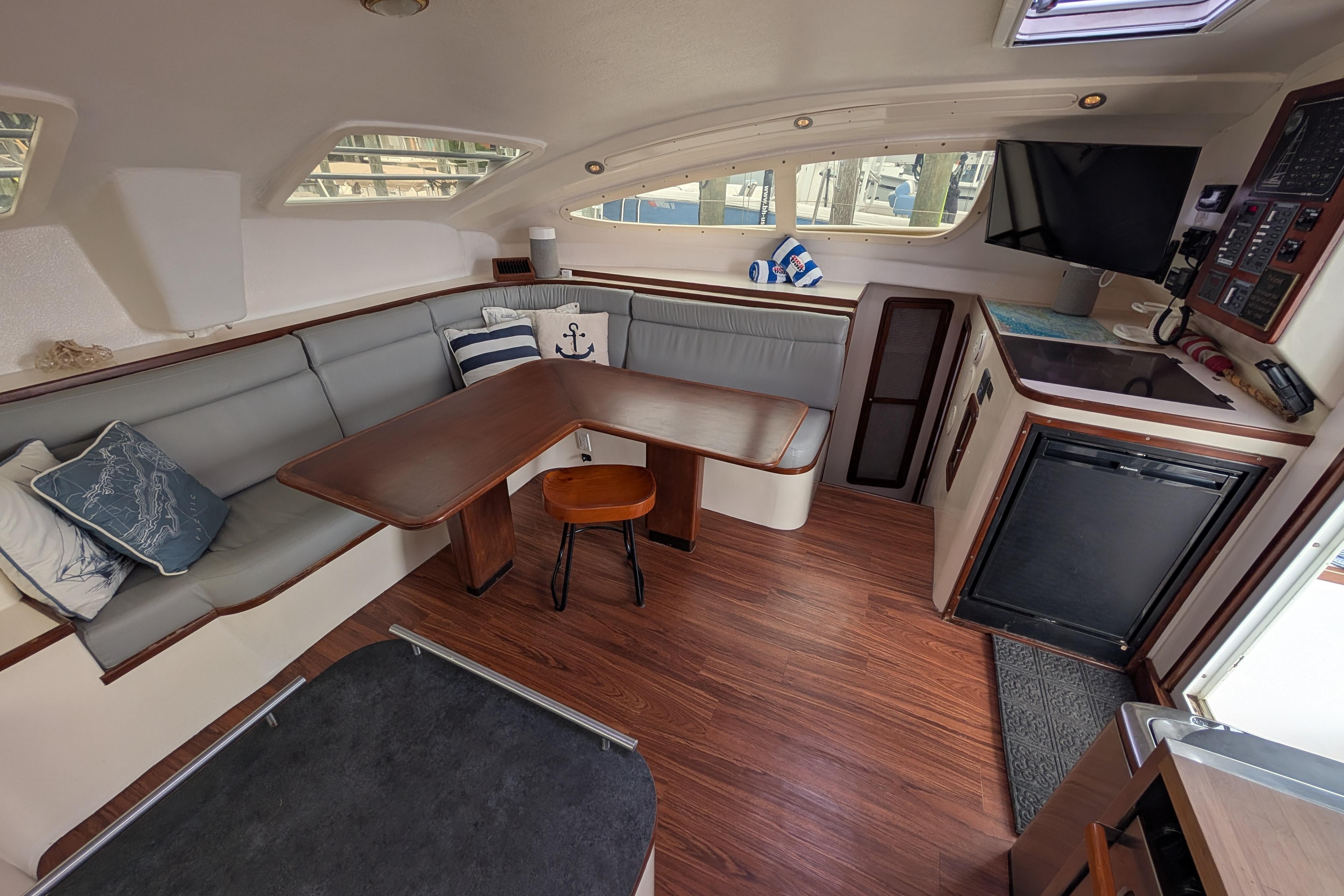 Interior of 1999 Island Spirit 37 yacht with cozy seating and modern amenities.