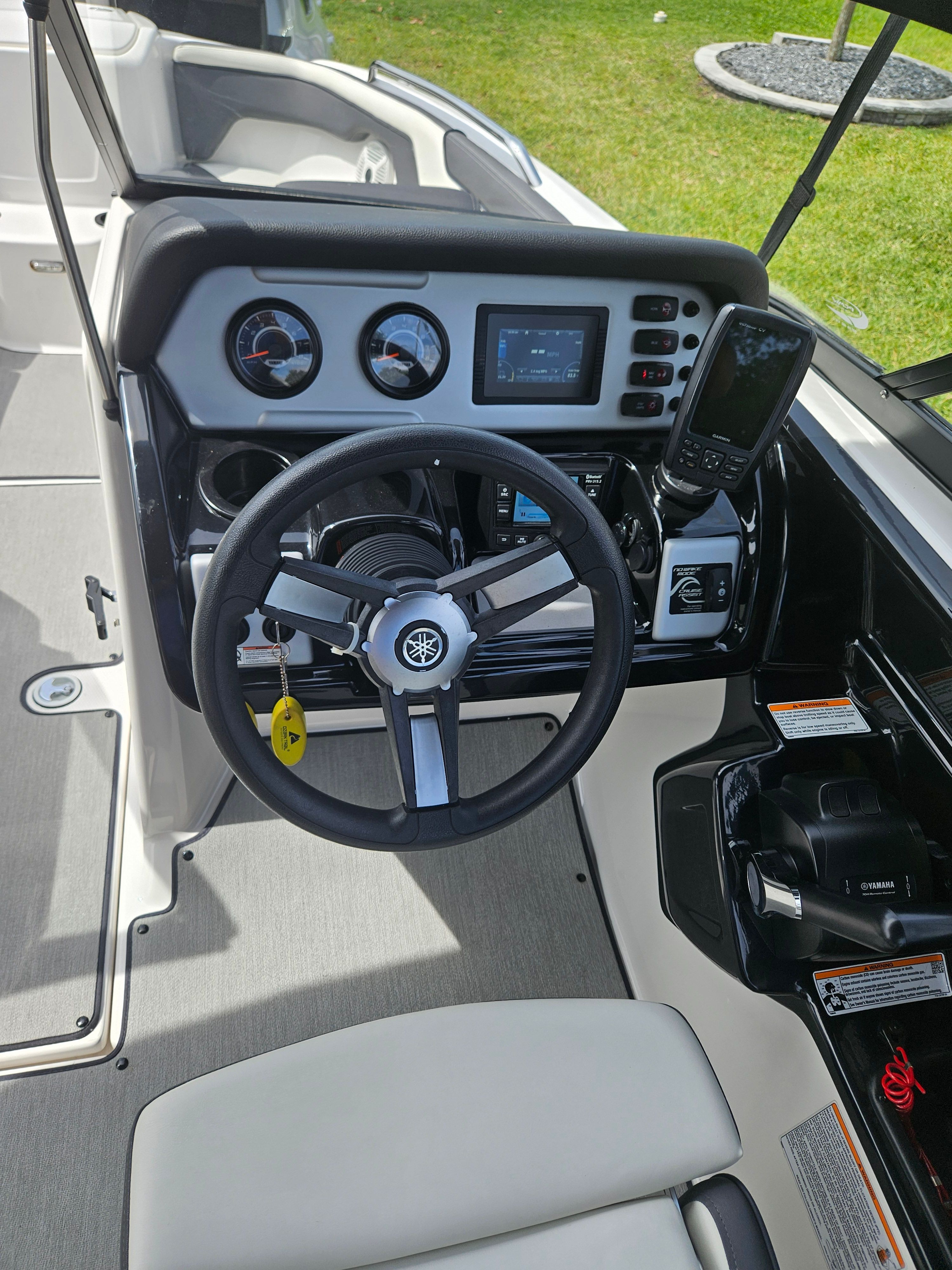 Yamaha SX210 2022 boat dashboard with steering wheel and instruments.