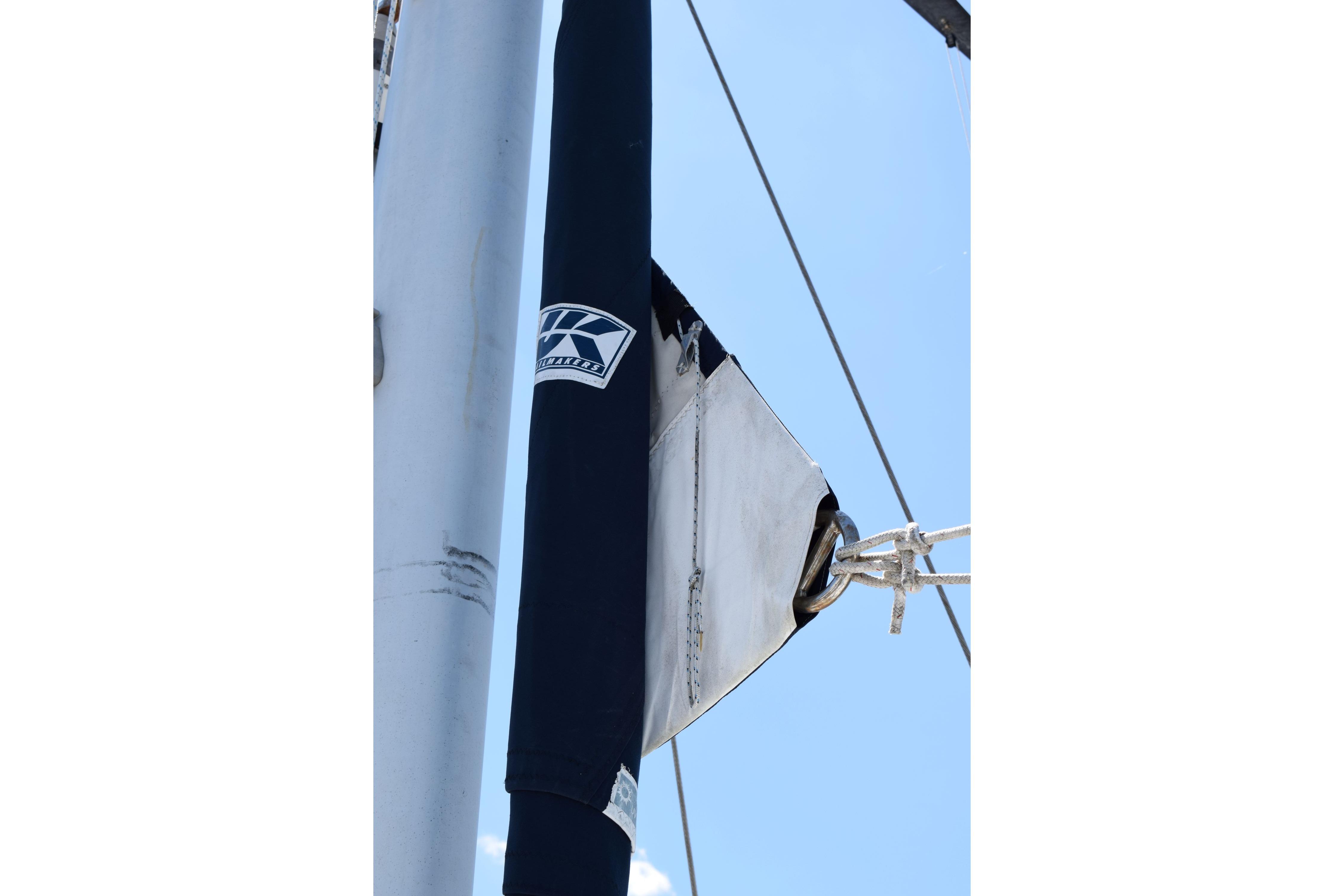 Mast detail of 1980 Cheoy Lee 52 Motorsailer against clear blue sky.