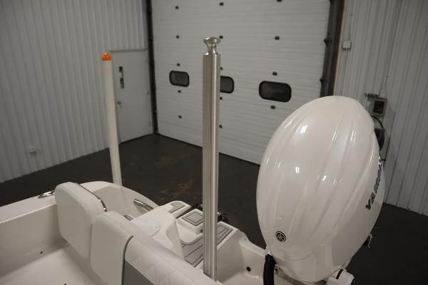 2025 Sea Fox 228 Commander boat with Yamaha outboard motor in a garage.