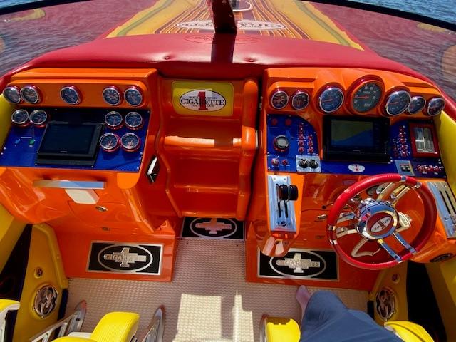 Vibrant 2009 Cigarette 399 Vee boat dashboard with colorful gauges and controls.