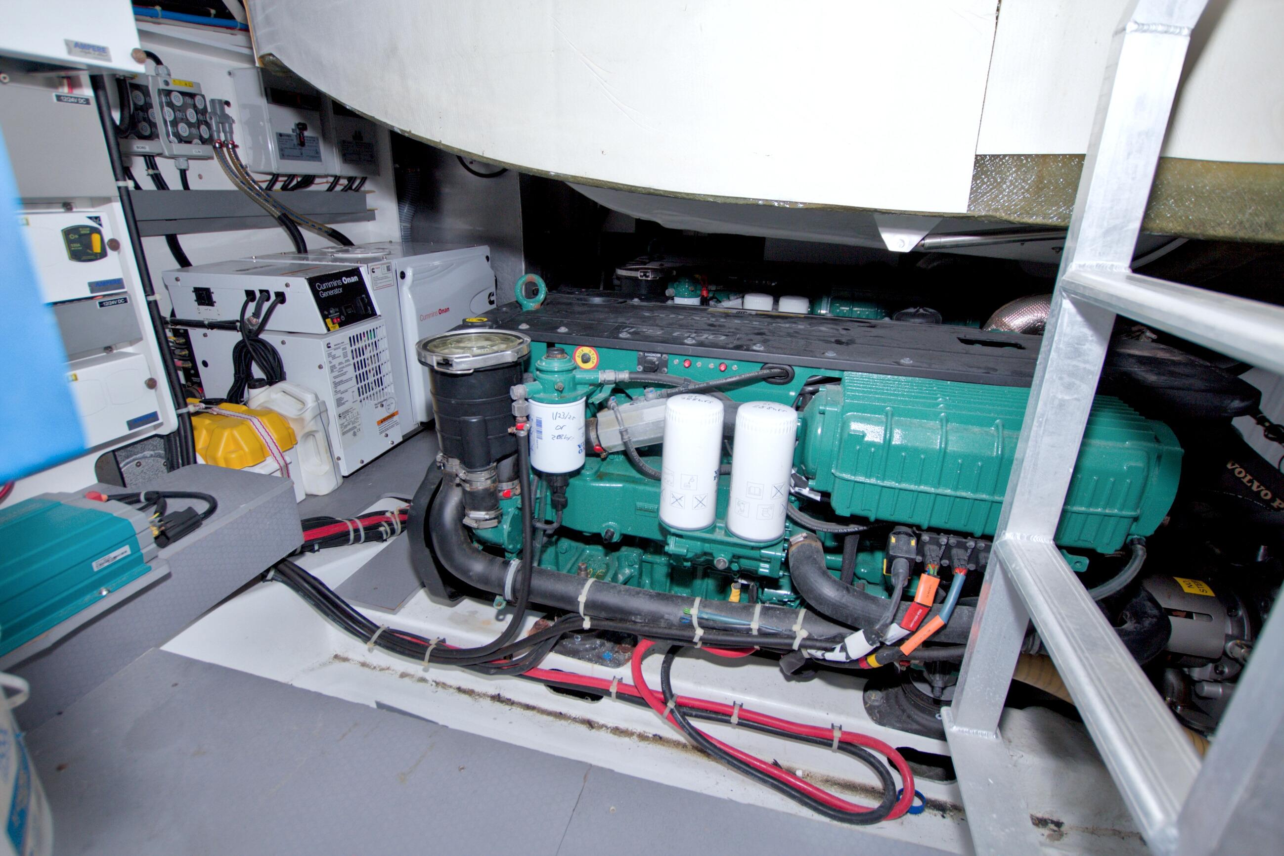 Engine room of 2019 Beneteau Gran Turismo 50 yacht, featuring Cummins generator and Volvo Penta engine.