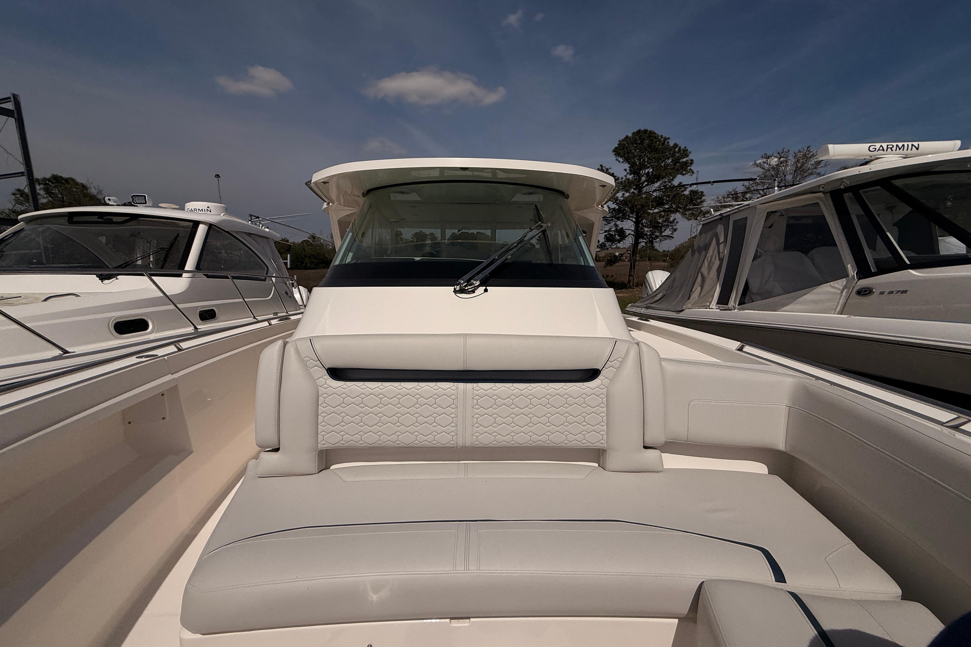 2022 Tiara Yachts 38 LS luxury boat interior with plush seating and modern design.