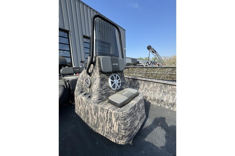 2023 Havoc 1756 MRST boat with camouflage design and modern console, outdoors.