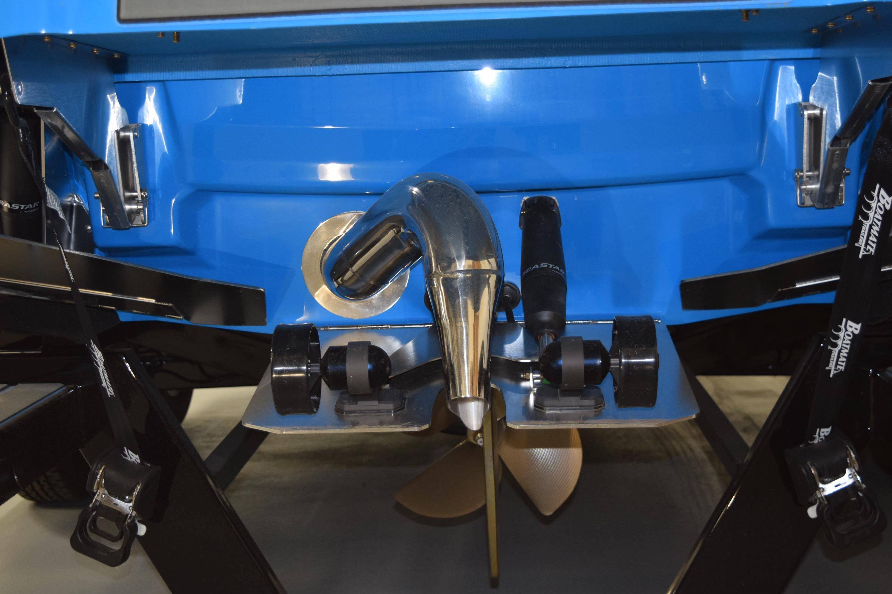 2026 Supra SA boat stern with propeller and blue hull detailing.