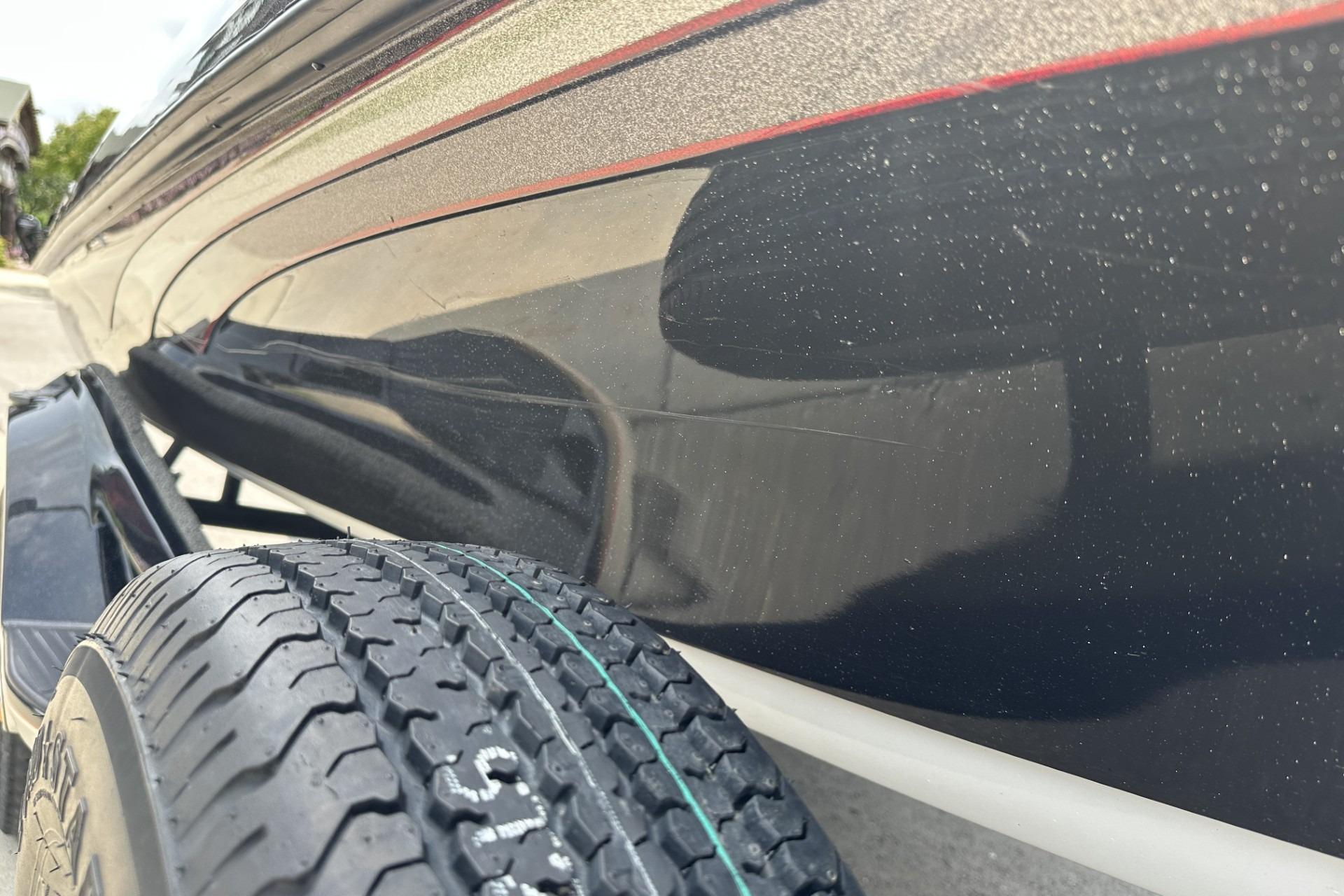 2018 Ranger Z518 boat close-up showing hull and trailer tire detail.
