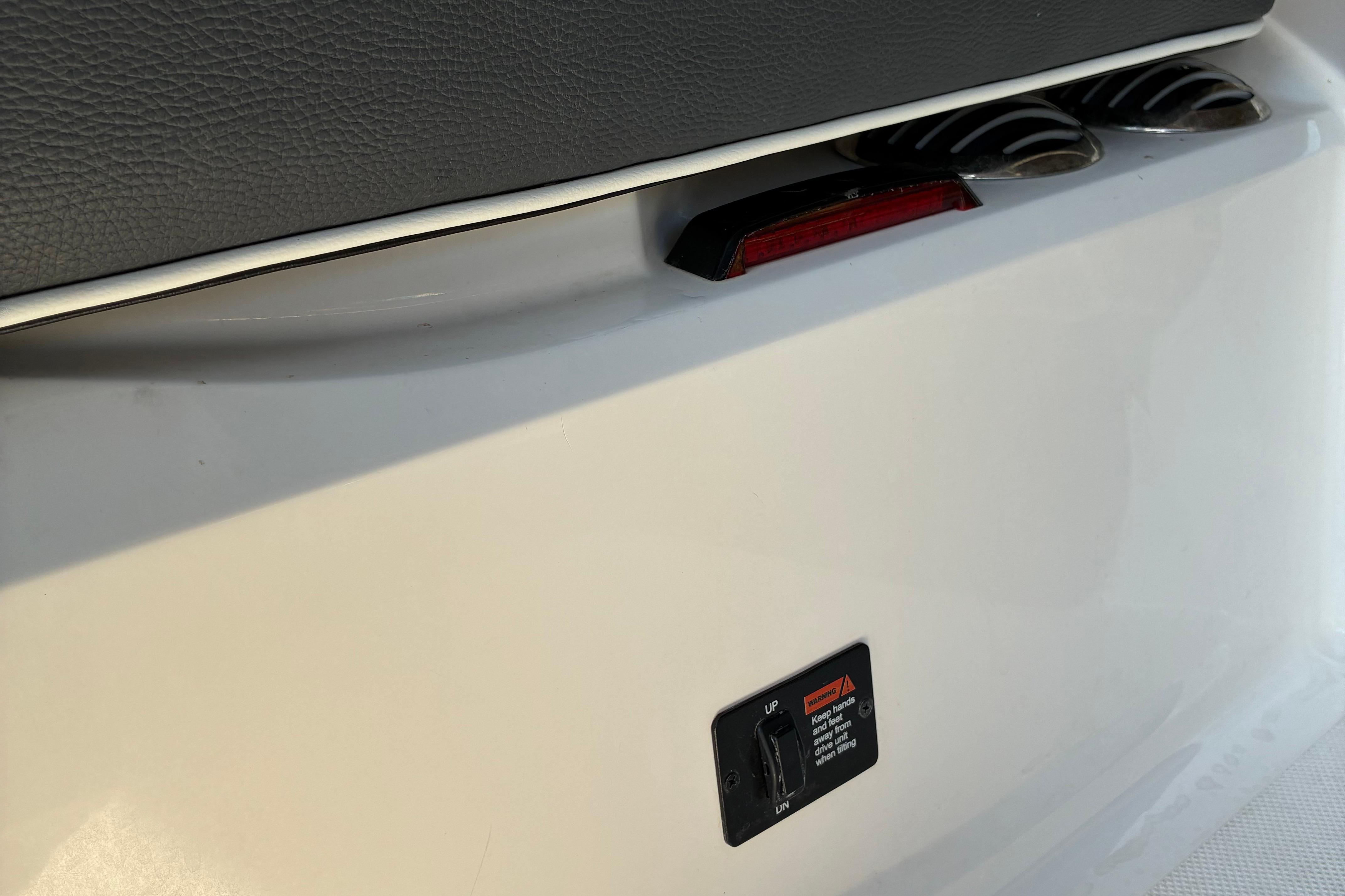 2025 Regal LS2 boat detail showing rear light and control panel.
