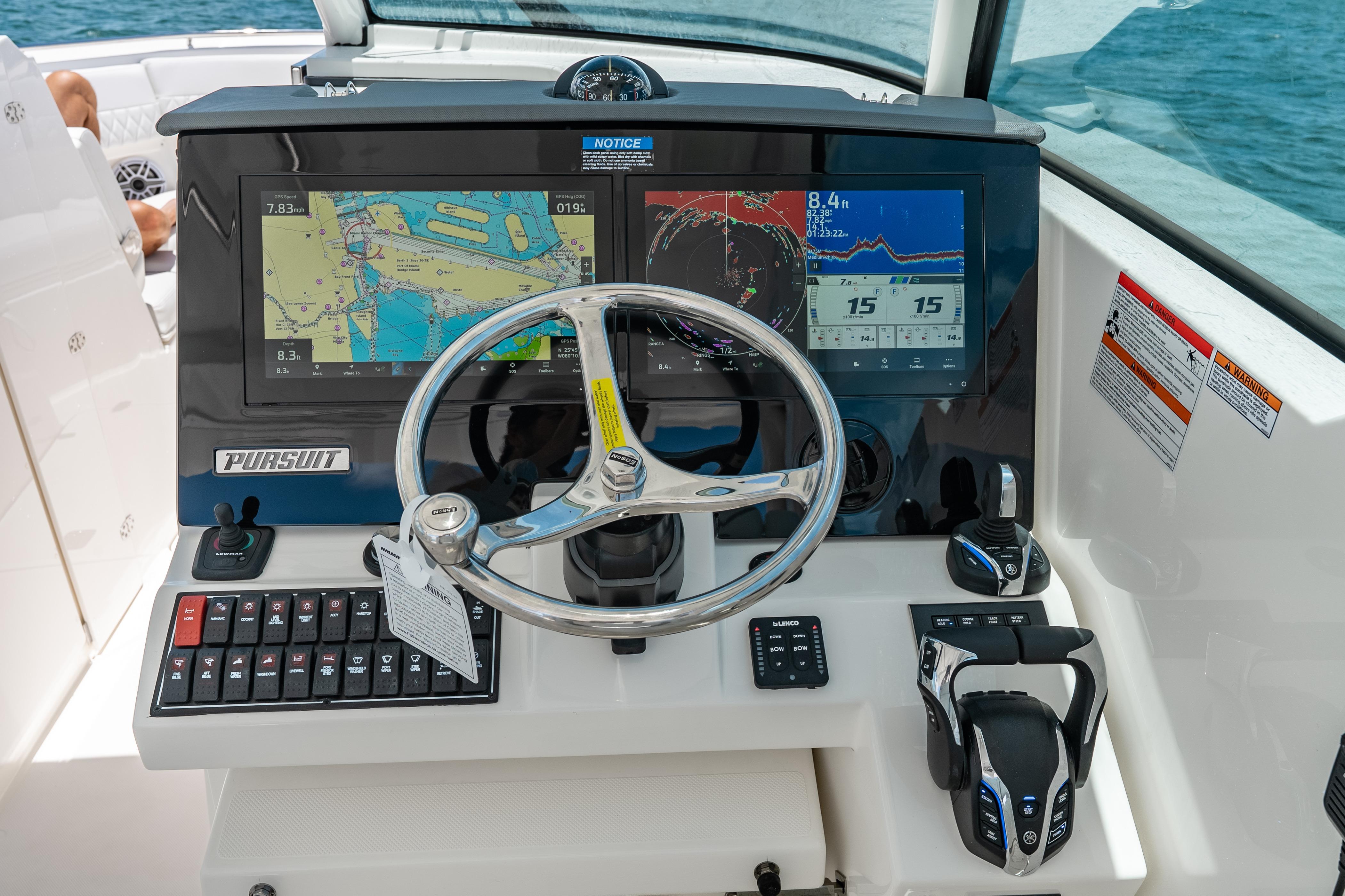 Helm of 2026 Pursuit DC 326 Dual Console with navigation screens and controls.