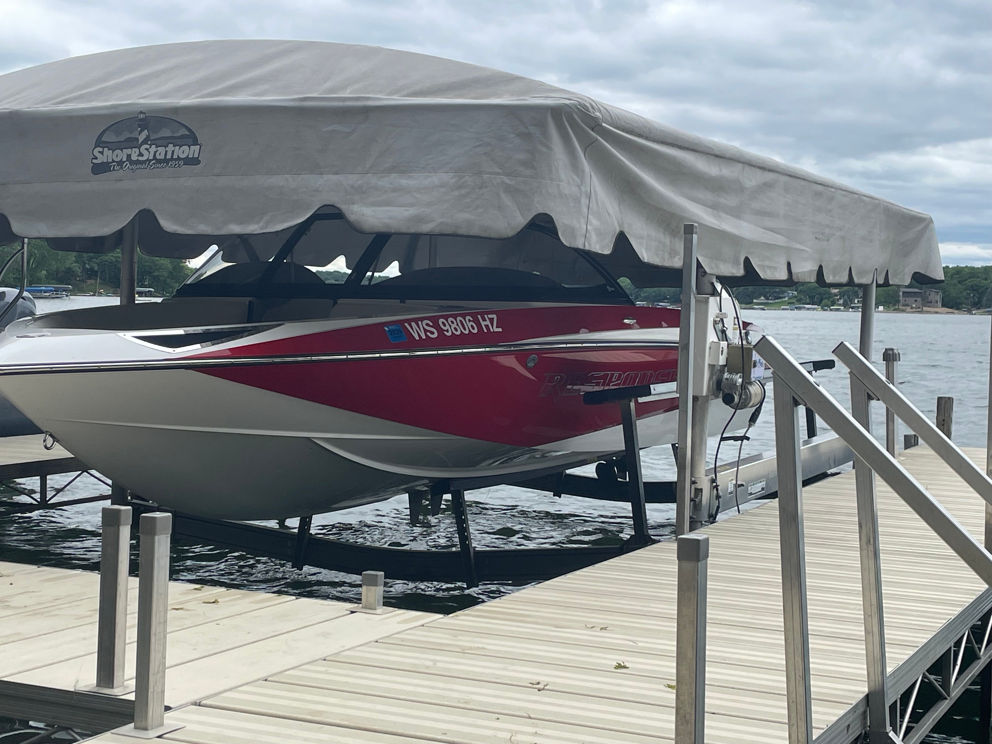 2014 Malibu Response TXi boat on a dock.