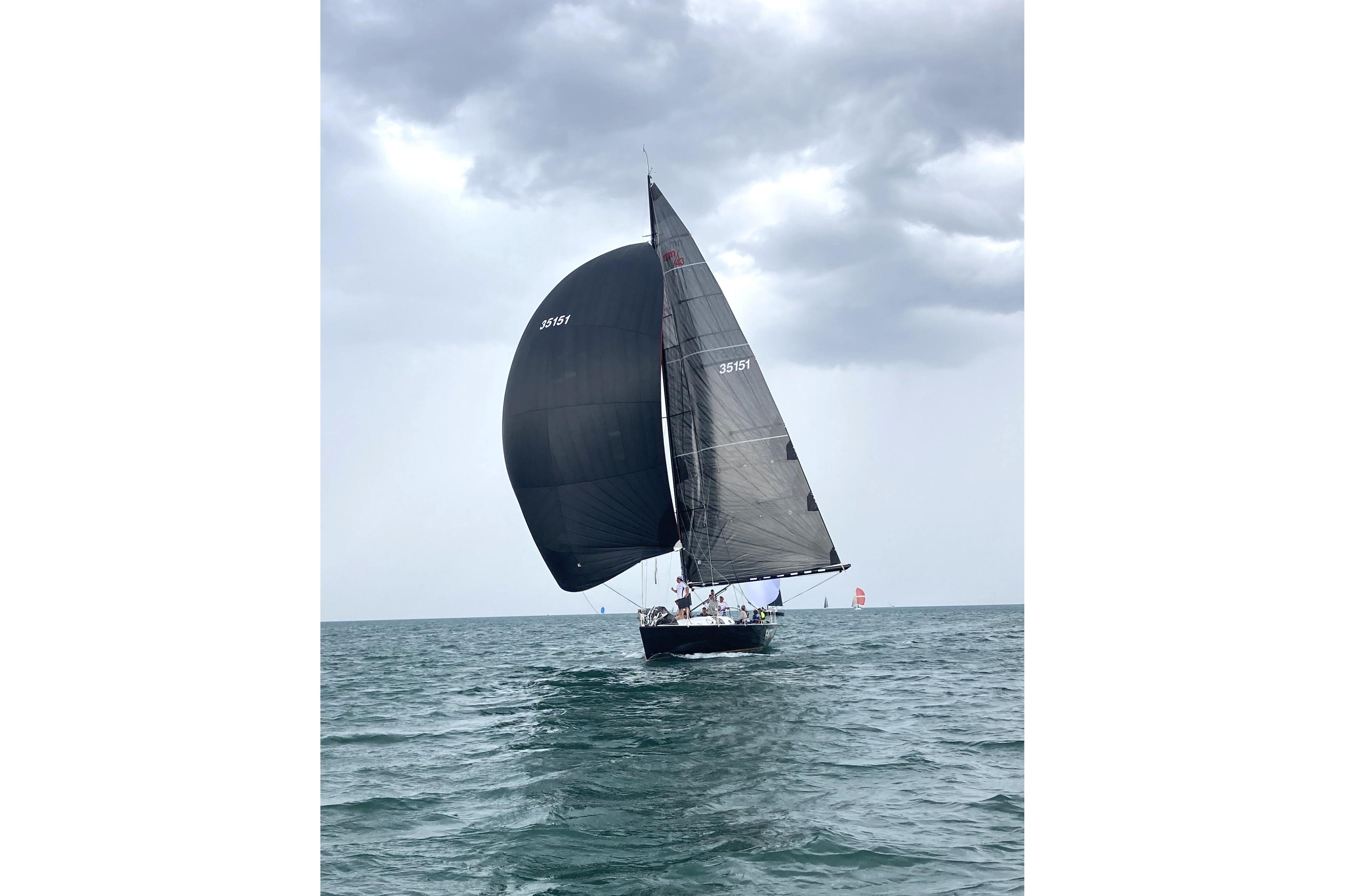 Sailing yacht Nelson Marek 43 (1993) on open water under cloudy skies.