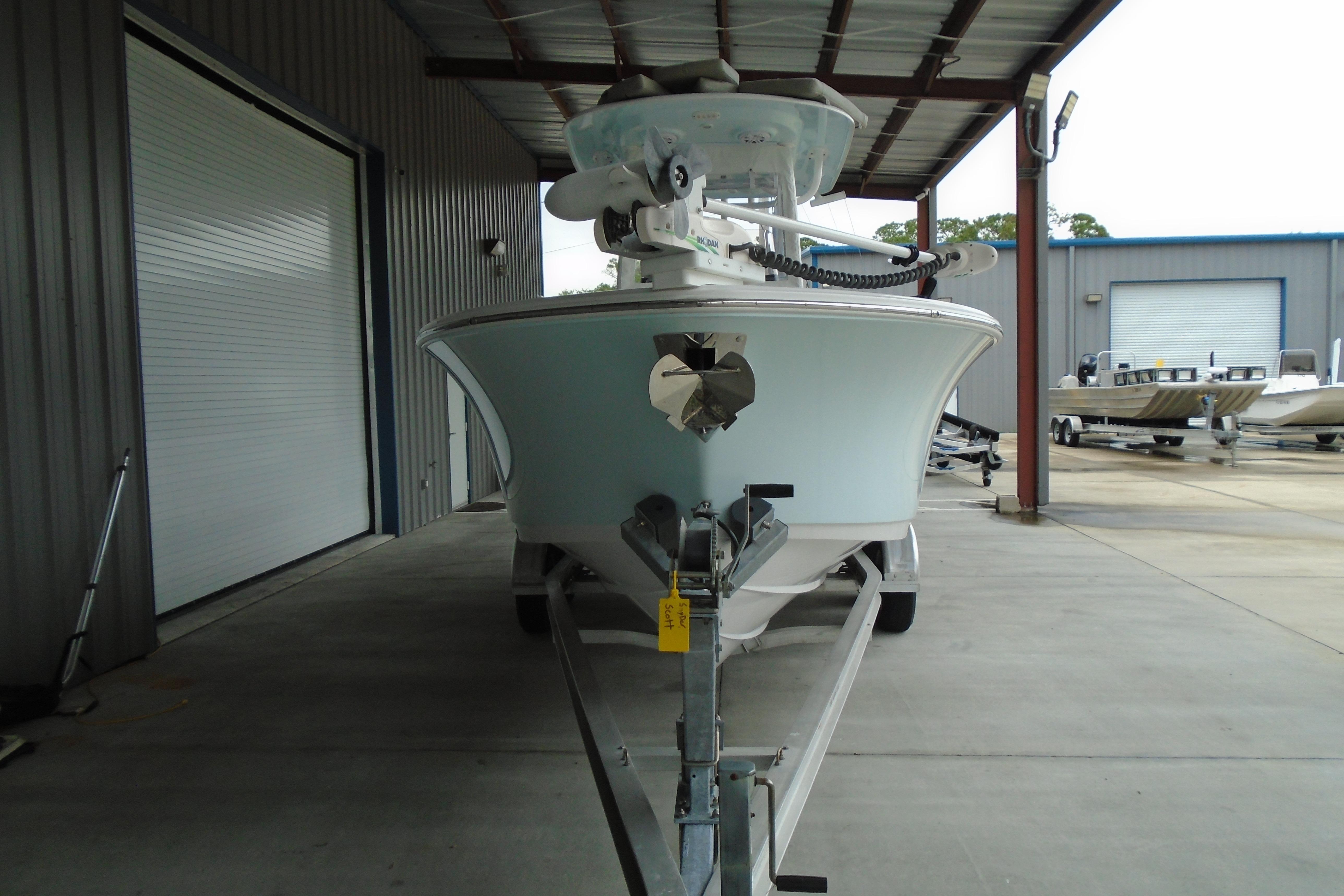 2022 Sportsman Heritage 241 Center Console boat on trailer in covered storage.