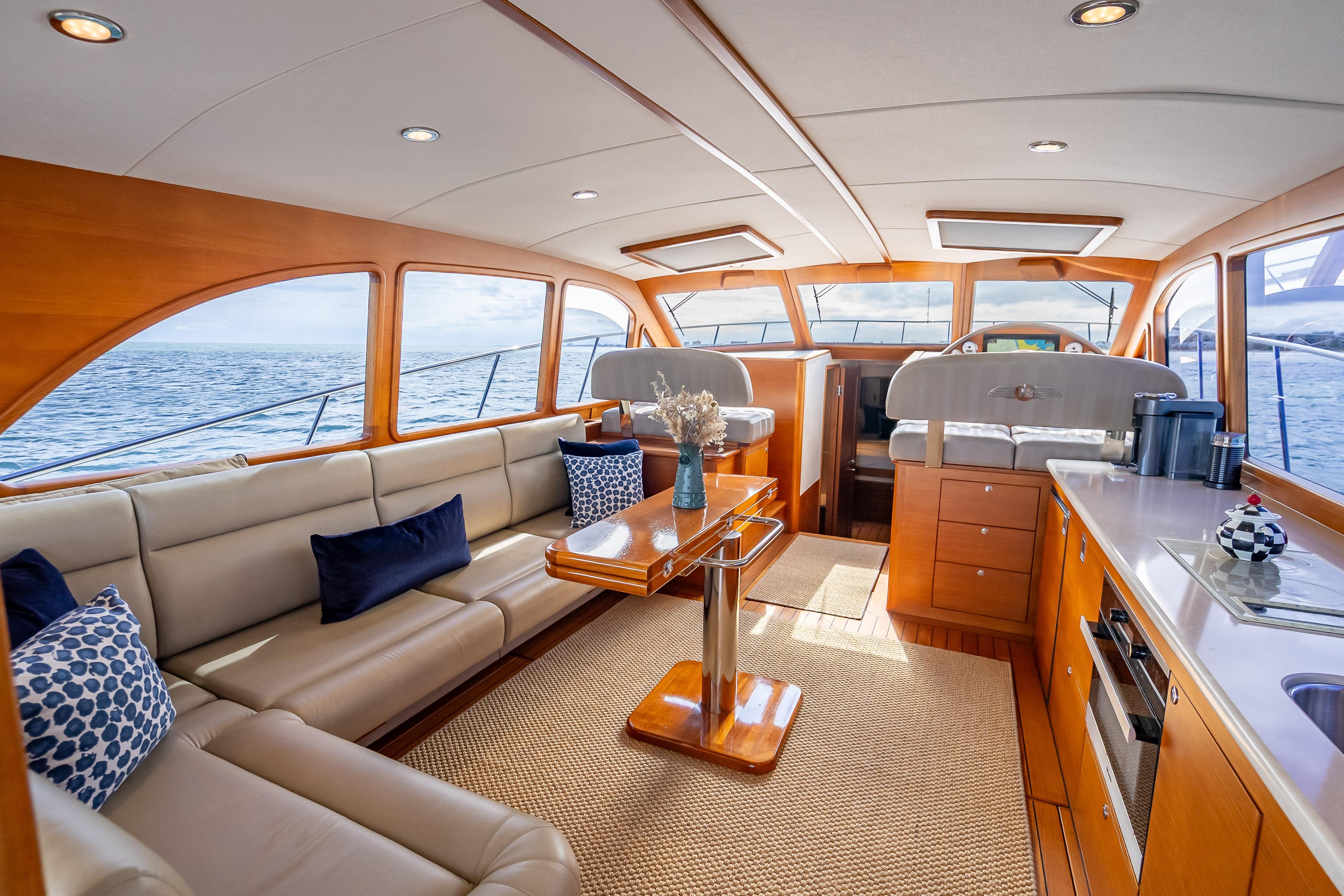Luxurious 2018 Palm Beach Motor Yachts PB50 interior with elegant seating and ocean view.