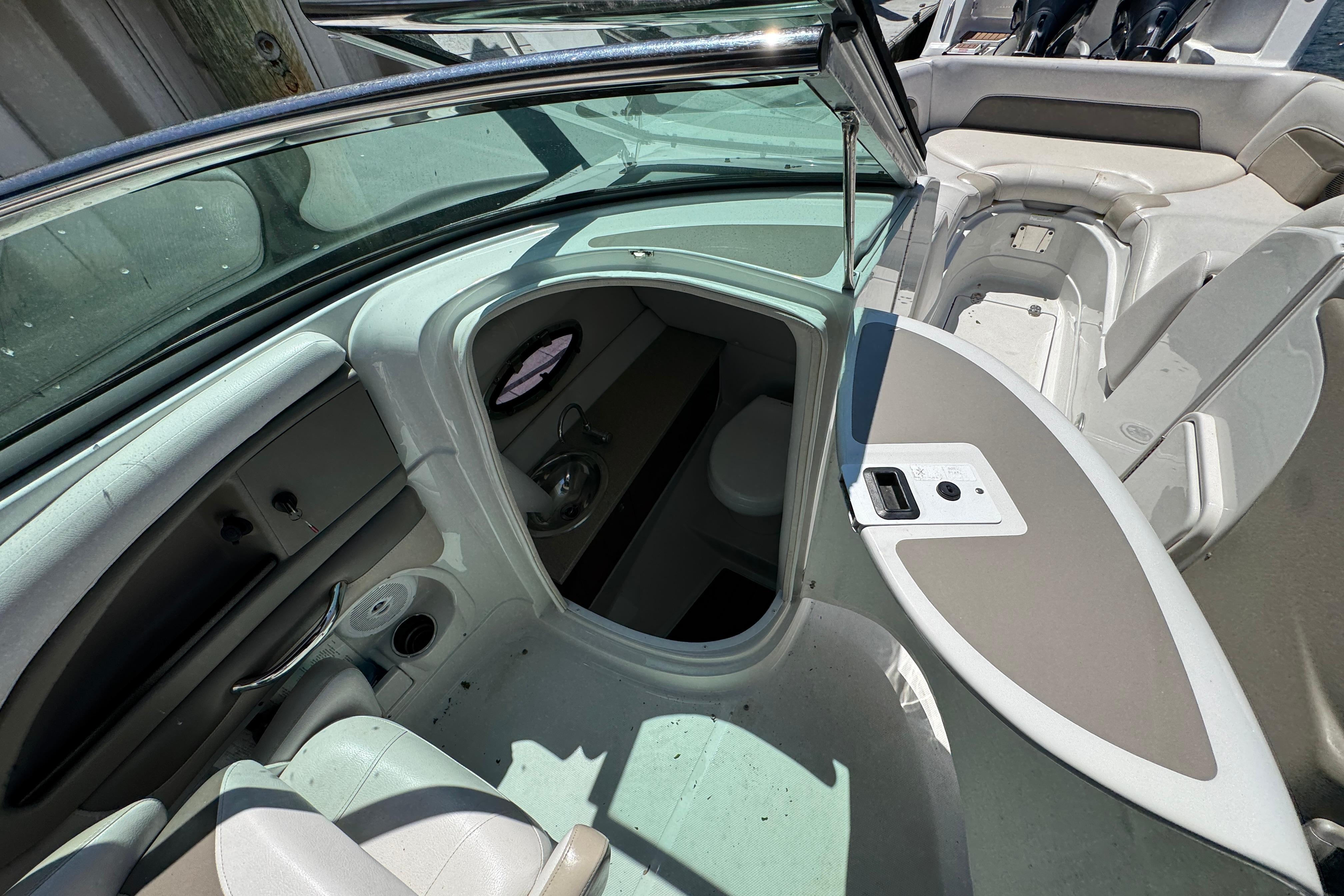 2013 Crownline Eclipse E6 XS boat interior with seating and storage compartments.