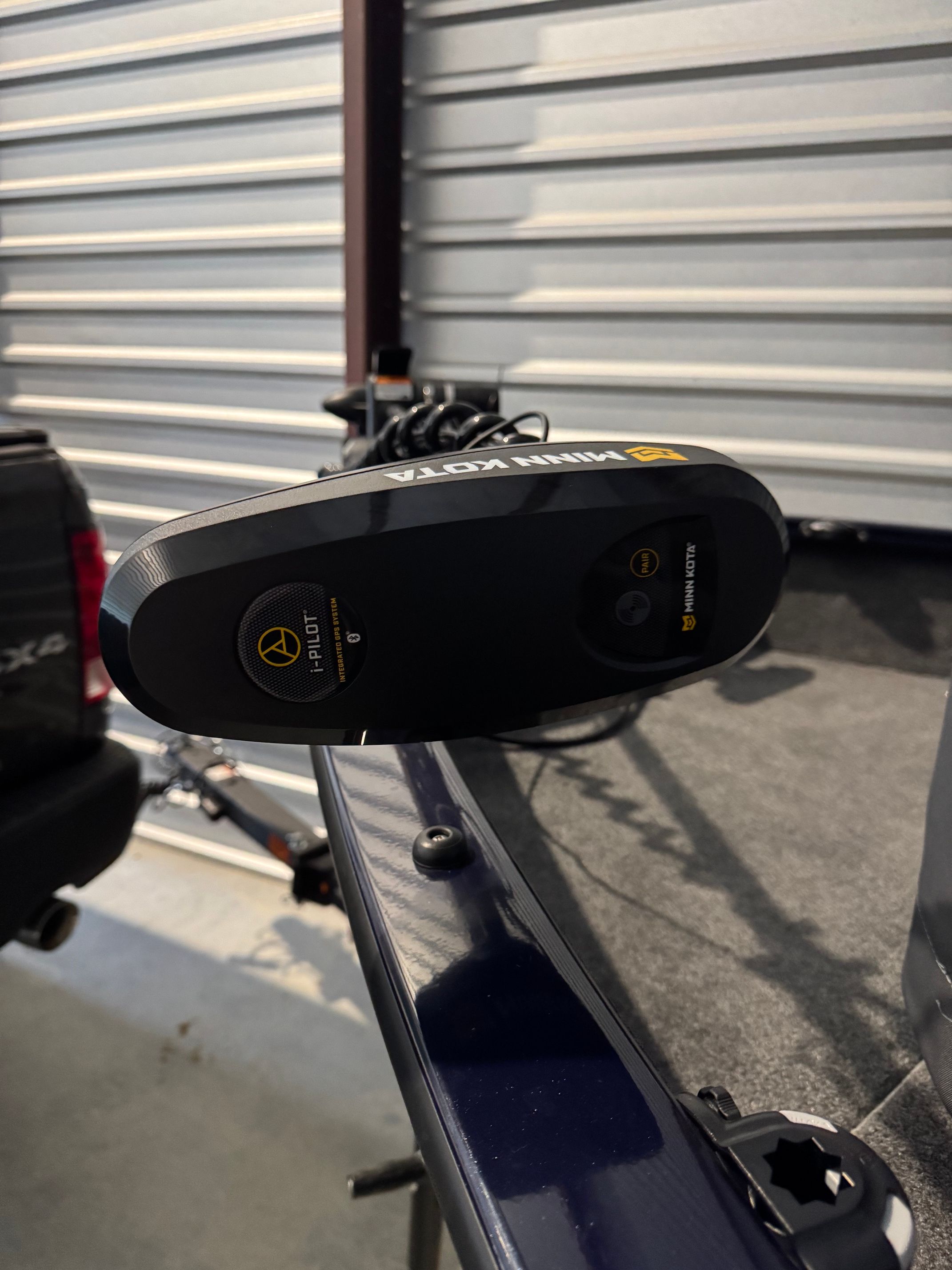 Close-up of a boat steering system in a garage.