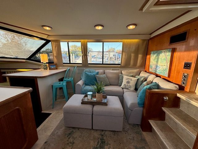 Interior of Carver 3807 yacht with cozy sofa and bar area.