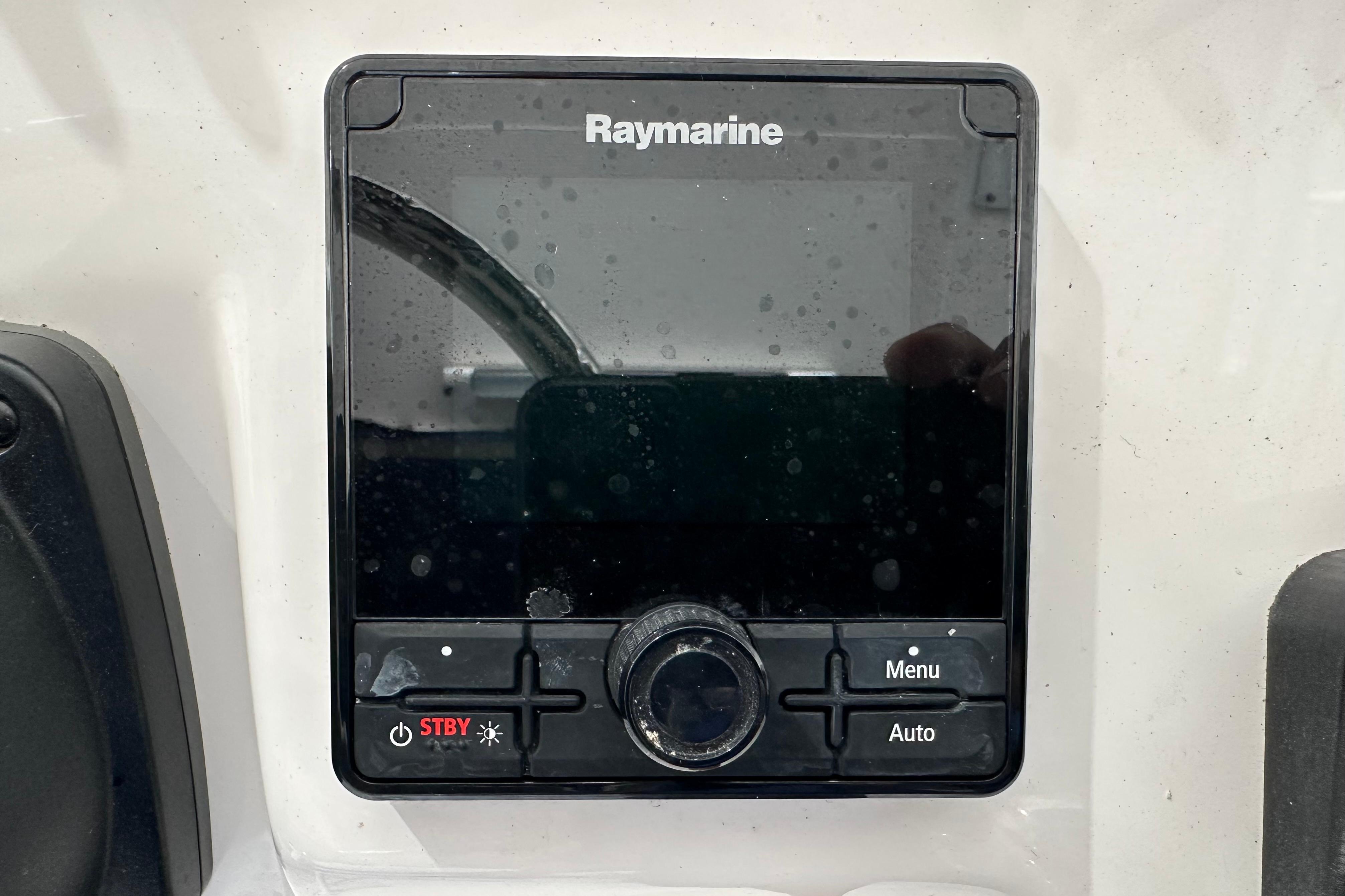Raymarine control panel on 2015 Edgewater 245CC boat dashboard.