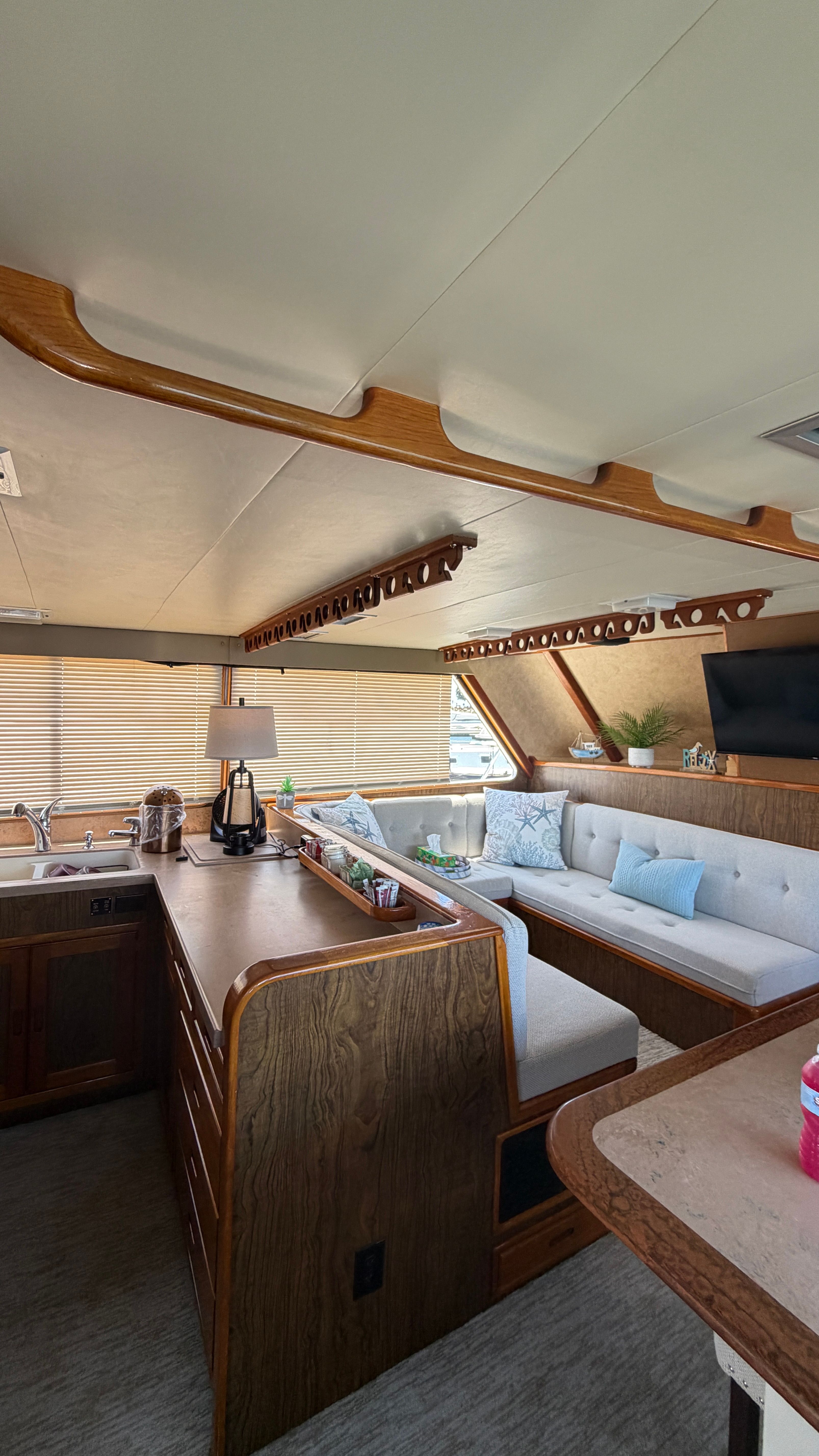 Interior of a 1966 Drake Yachtfisher with cozy seating area.