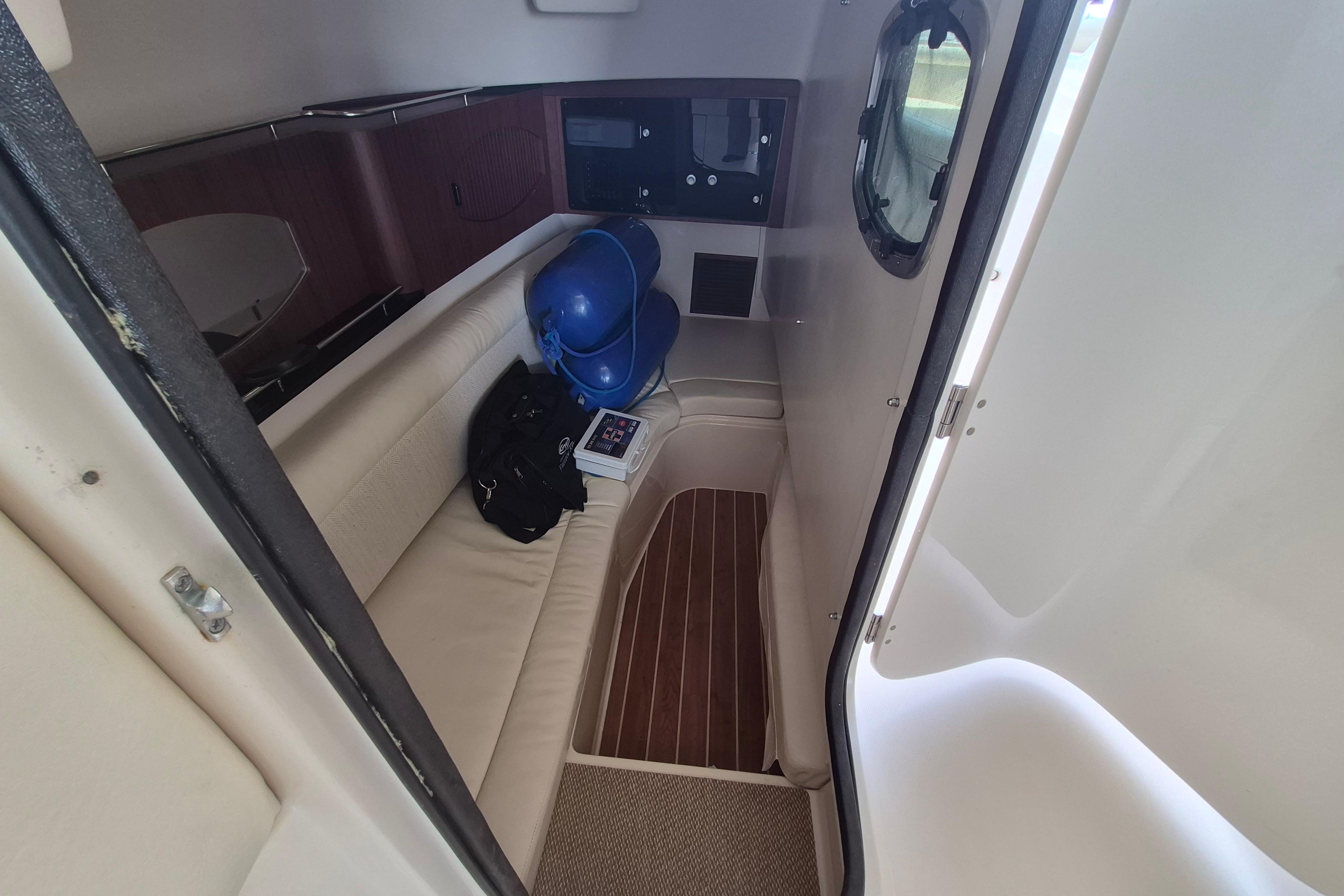 2019 Grady-White Freedom 335 cabin interior with seating and storage.